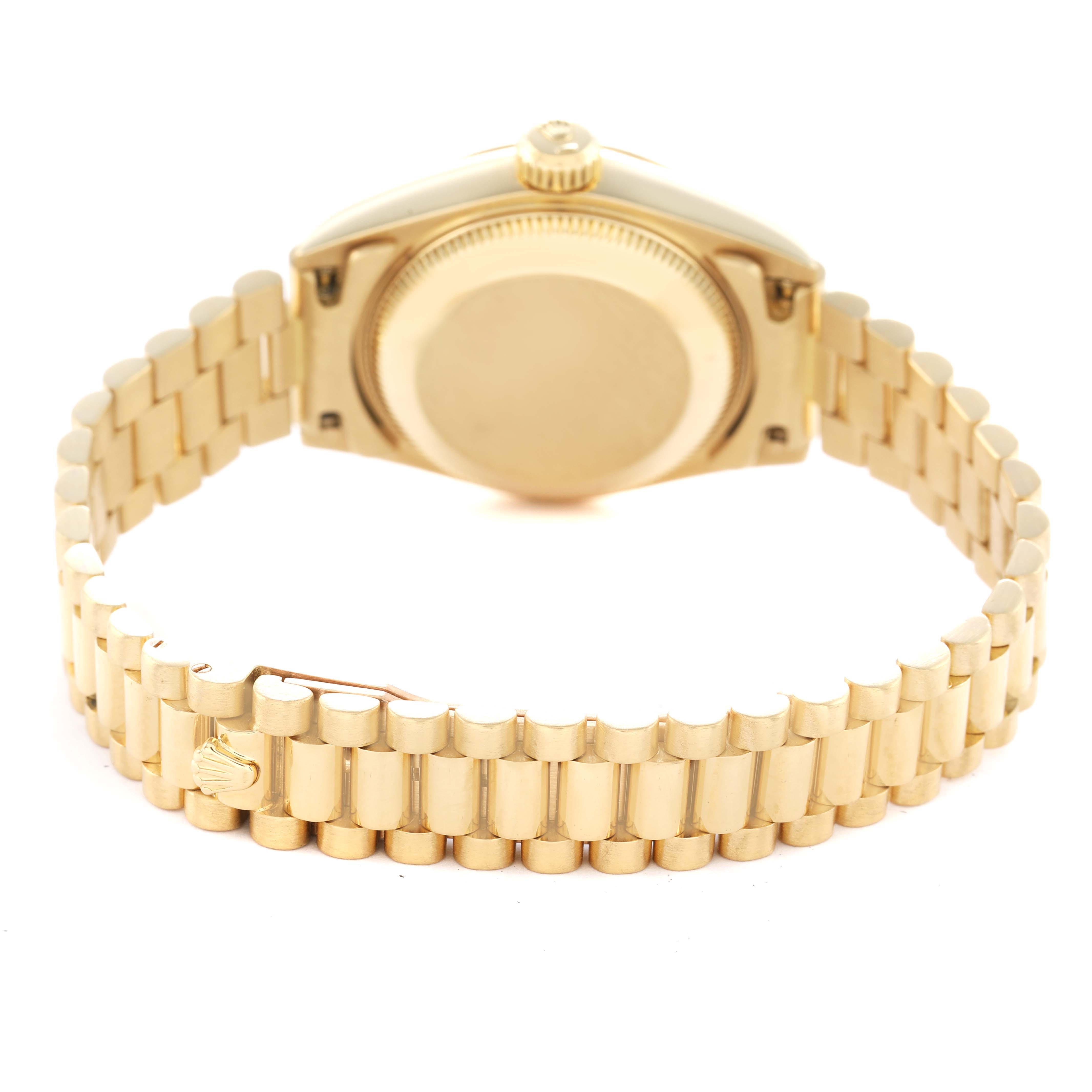 This image shows the backside of a Rolex President 69178 Women's Yellow Gold Black Dial model watch, highlighting its bracelet and clasp.