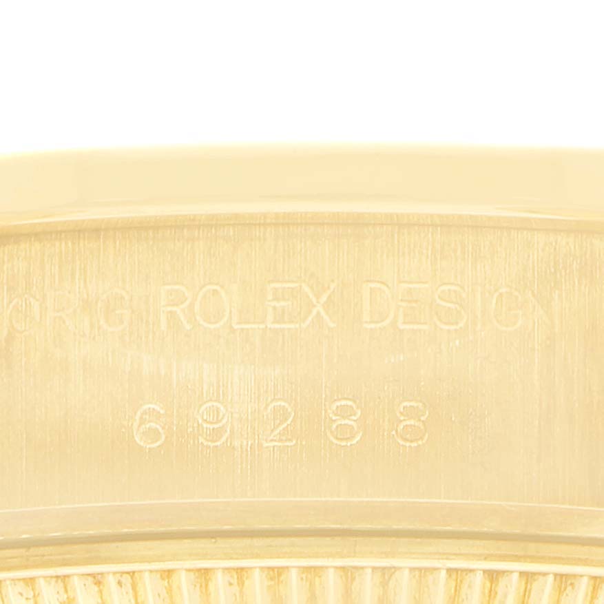 The image shows a close-up of the engraved side of the Rolex President 69288 Women's Yellow Gold Blue Dial model watch.