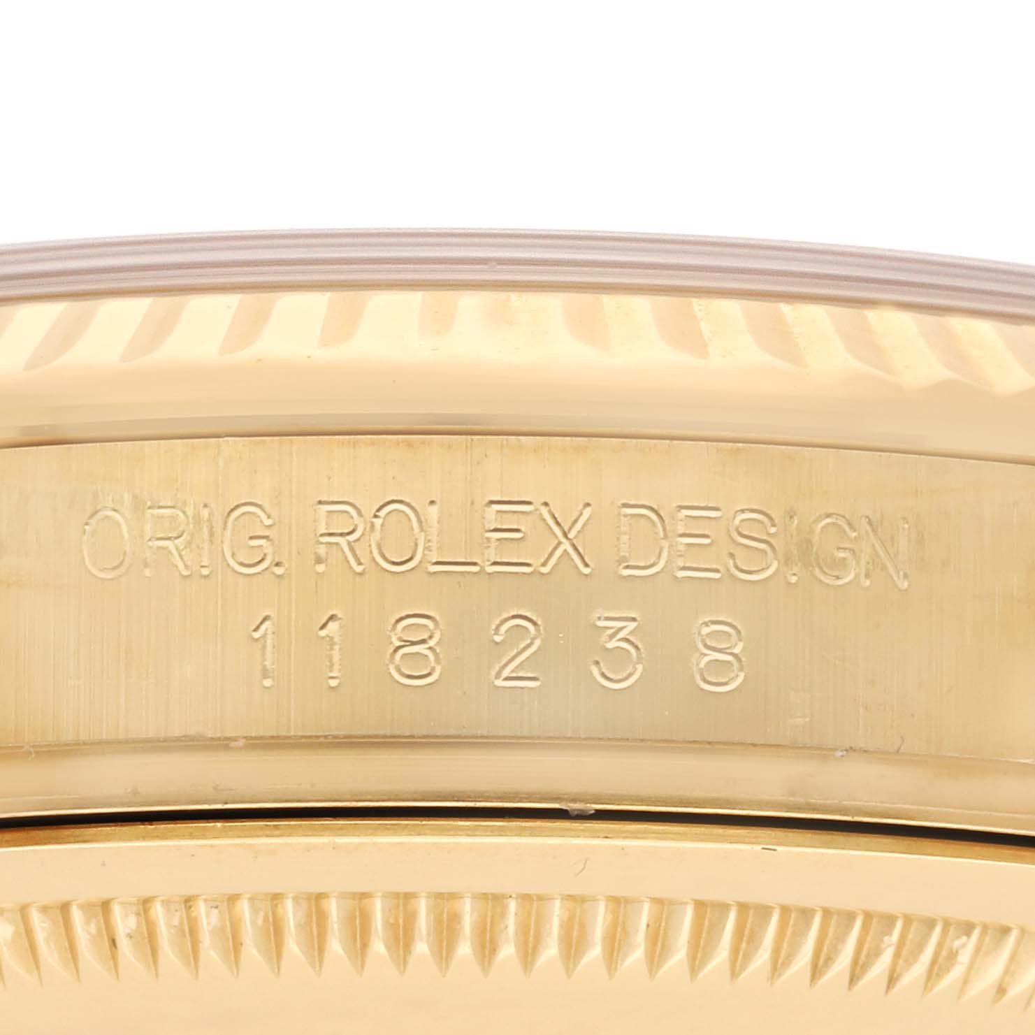 The image shows a close-up of the Rolex President 118238 Men
s Yellow Gold Champagne Dial 118238 Men
s Yellow Gold Champagne Dial model
s case side, displaying the model number engraving.