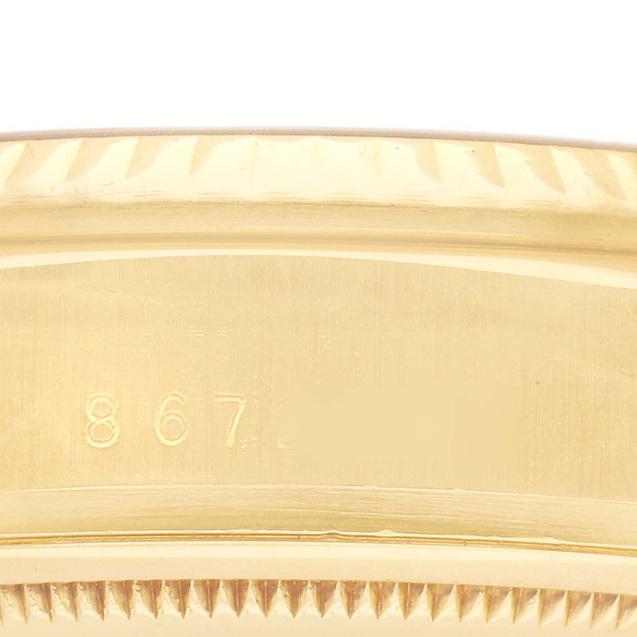 The image shows a close-up of the Rolex President 18038 Men's Yellow Gold Champagne Dial model's gold case side with partial serial number visible.