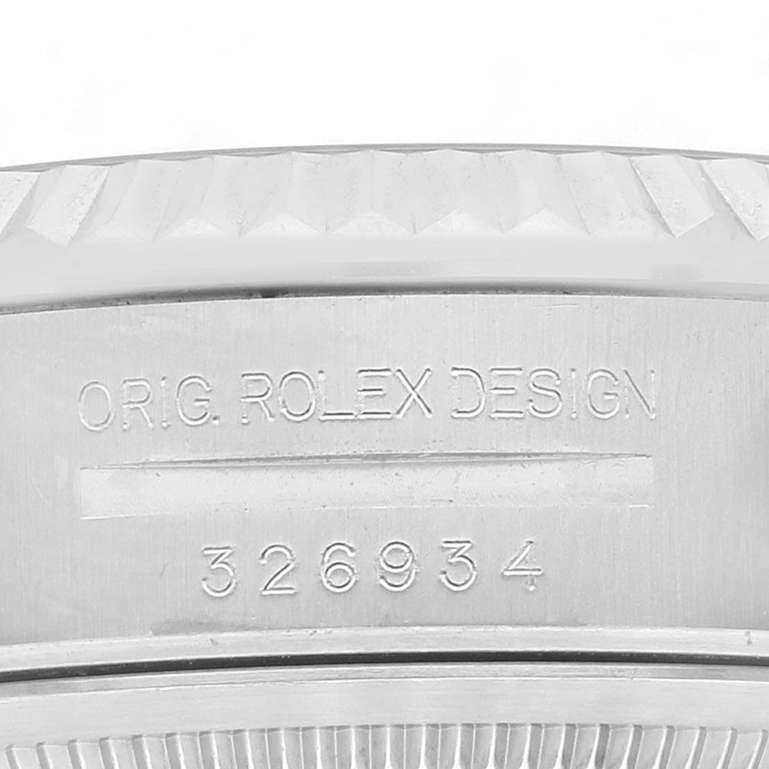 The image shows a close-up of the case back and serial number engraving of a Rolex Sky-Dweller 326934 Men's Stainless Steel White Dial 326934 Men's Stainless Steel White Dial watch.