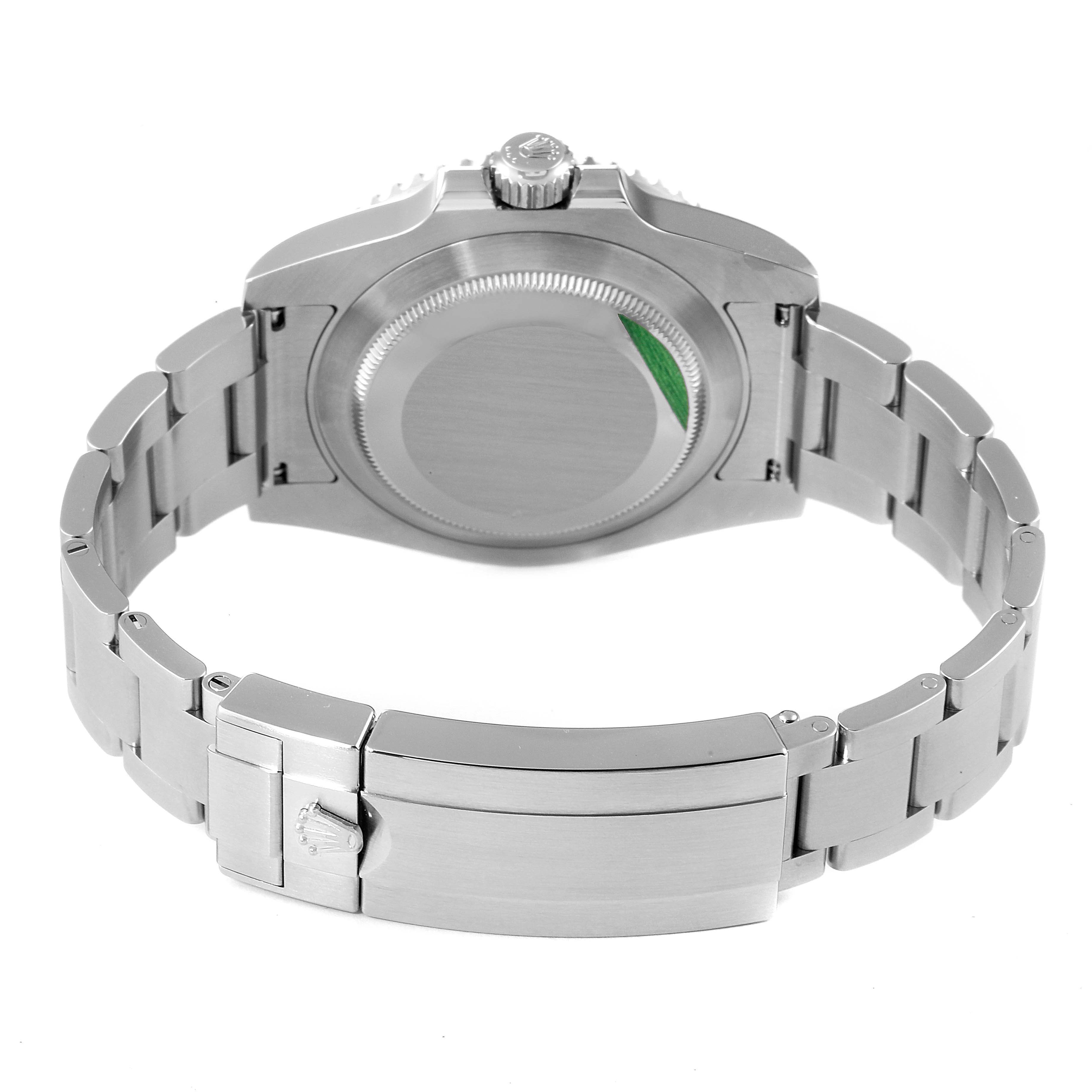 The image shows the back of a Rolex Submariner 116610LV Men
s Stainless Steel Green Dial 116610LV Men
s Stainless Steel Green Dial watch, highlighting its closed case back, crown, and bracelet with clasp.