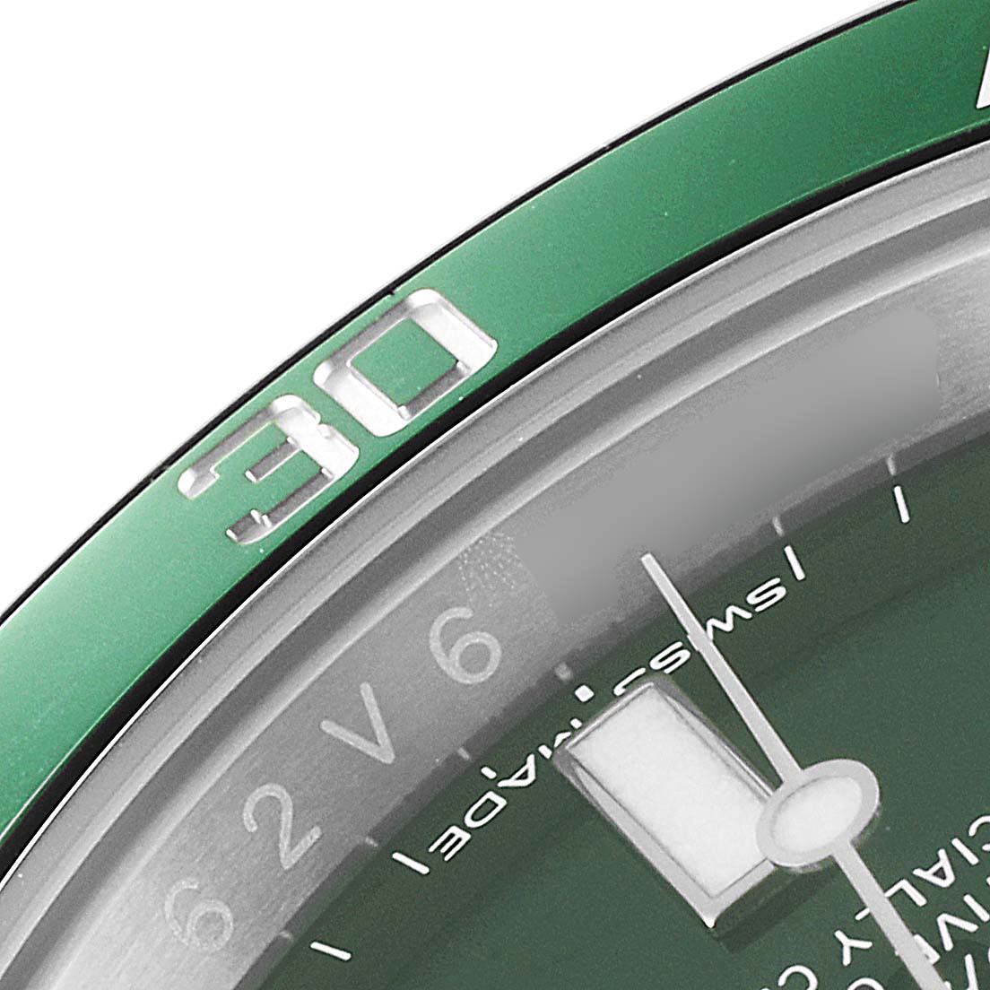 This image shows a close-up of the green bezel, dial, and minute hand of a Rolex Submariner 116610LV Men
s Stainless Steel Green Dial 116610LV Men
s Stainless Steel Green Dial watch.