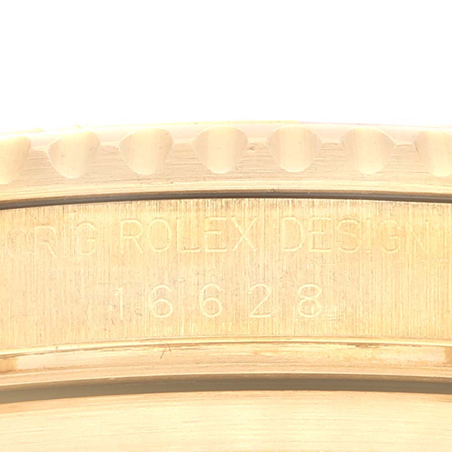 This close-up image shows the engraved inner bezel of a Rolex Yacht-Master 16628 Men's Yellow Gold Champagne Dial 16628 Men's Yellow Gold Champagne Dial watch, highlighting the model number 16628.