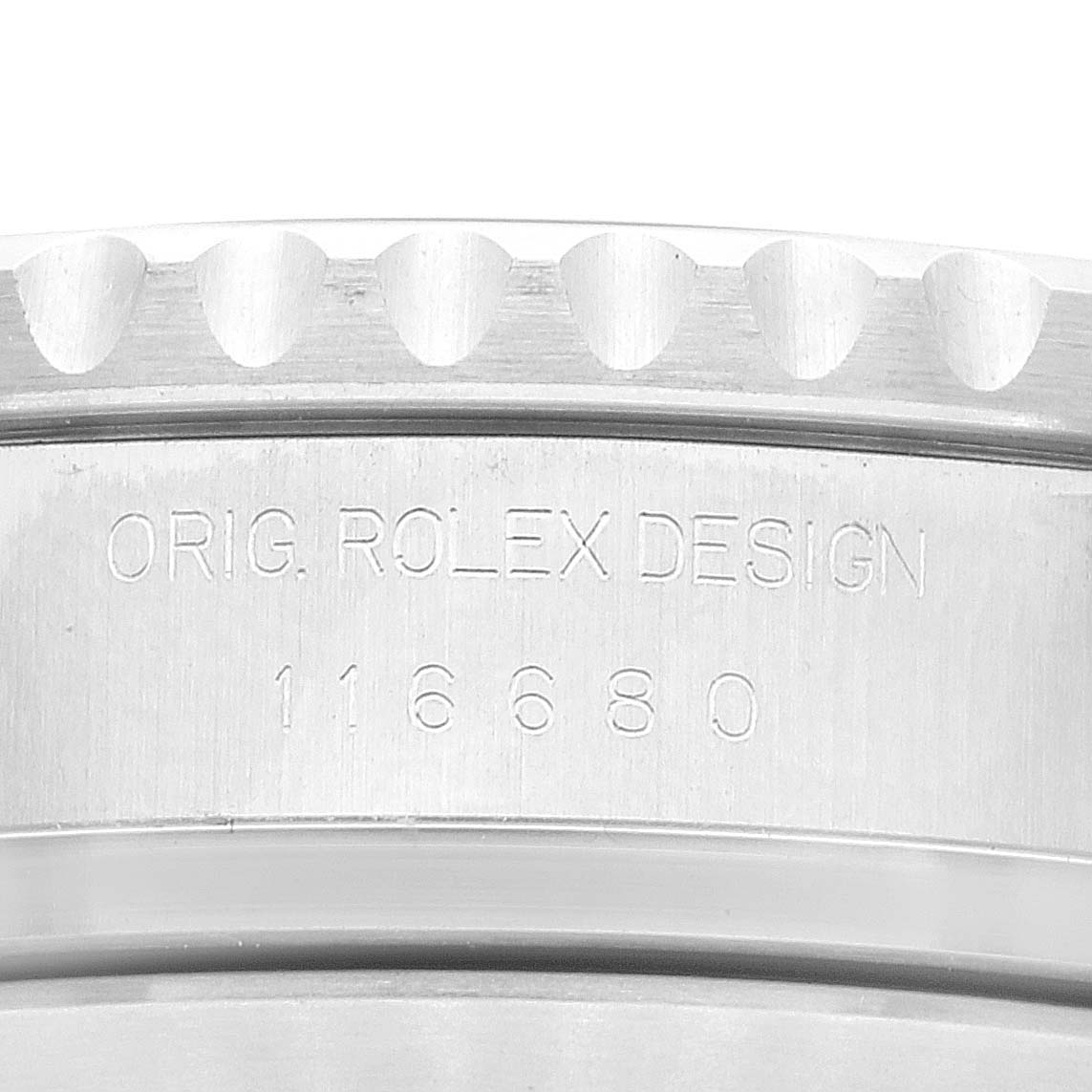 Close-up of the bezel and caseback edge of a Rolex Yacht-Master 116680 Men's Stainless Steel White Dial 116680 Men's Stainless Steel White Dial watch, displaying the model number 116680 and "ORIG. ROLEX DESIGN" engraving.