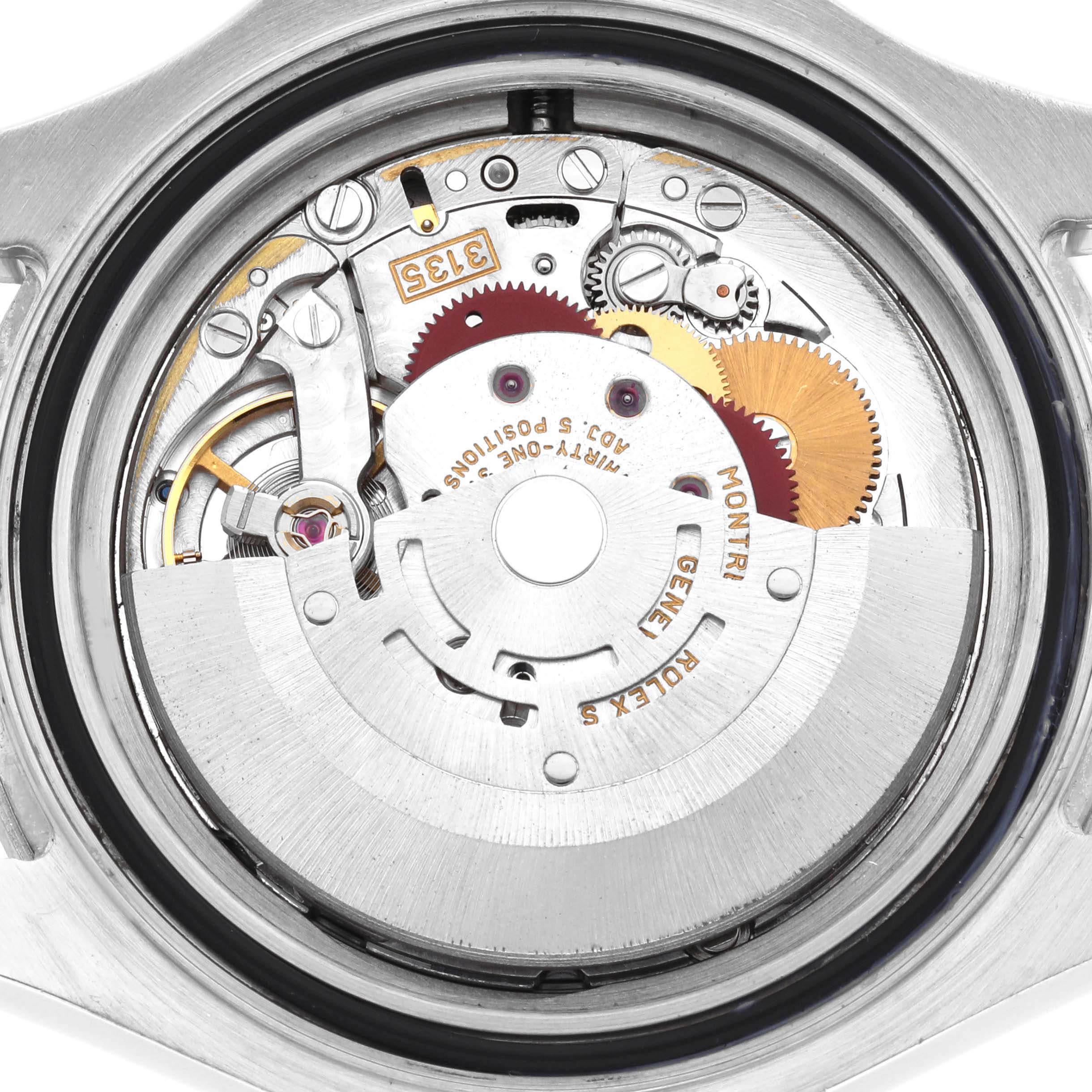 The image shows the movement mechanism of a Rolex Yacht-Master 16622 Men's Stainless Steel Silver Dial watch from a rear angle, highlighting gears and components.