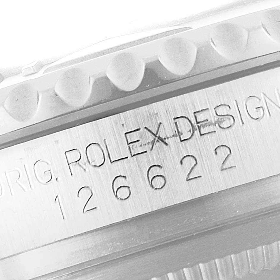 Close-up of the case side of a Rolex Yacht-Master 126622 Men's Stainless Steel Blue Dial 126622 Men's Stainless Steel Blue Dial, showing engraving details and part of the bezel.