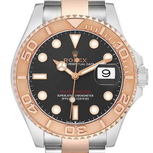 The Rolex Yacht-Master 126621 Men's Steel and Gold (two tone) Black Dial watch is shown from a front angle, displaying the bezel, dial, markers, and date window.