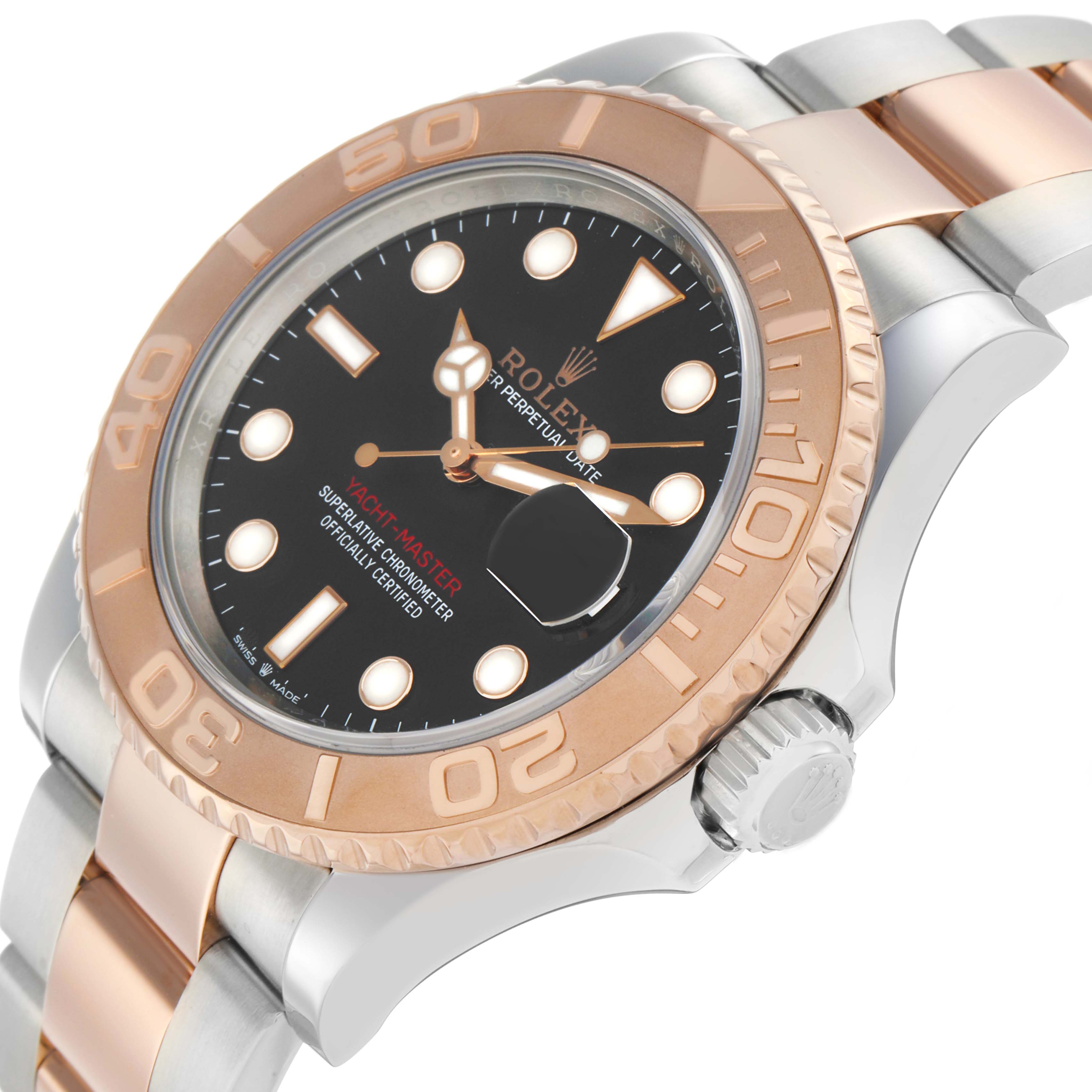 The image shows a Rolex Yacht-Master 126621 Men's Steel and Gold (two tone) Black Dial watch from an angled side view, highlighting the bezel, dial, crown, and part of the bracelet.