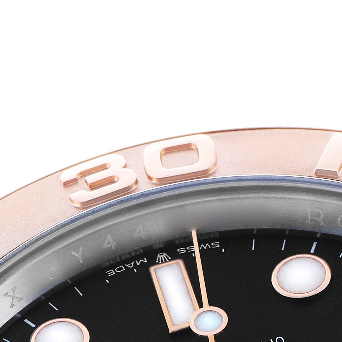 The image shows a close-up of the Rolex Yacht-Master 126621 Men's Steel and Gold (two tone) Black Dial's bezel and dial, highlighting the "30" marker and part of the hour markers.