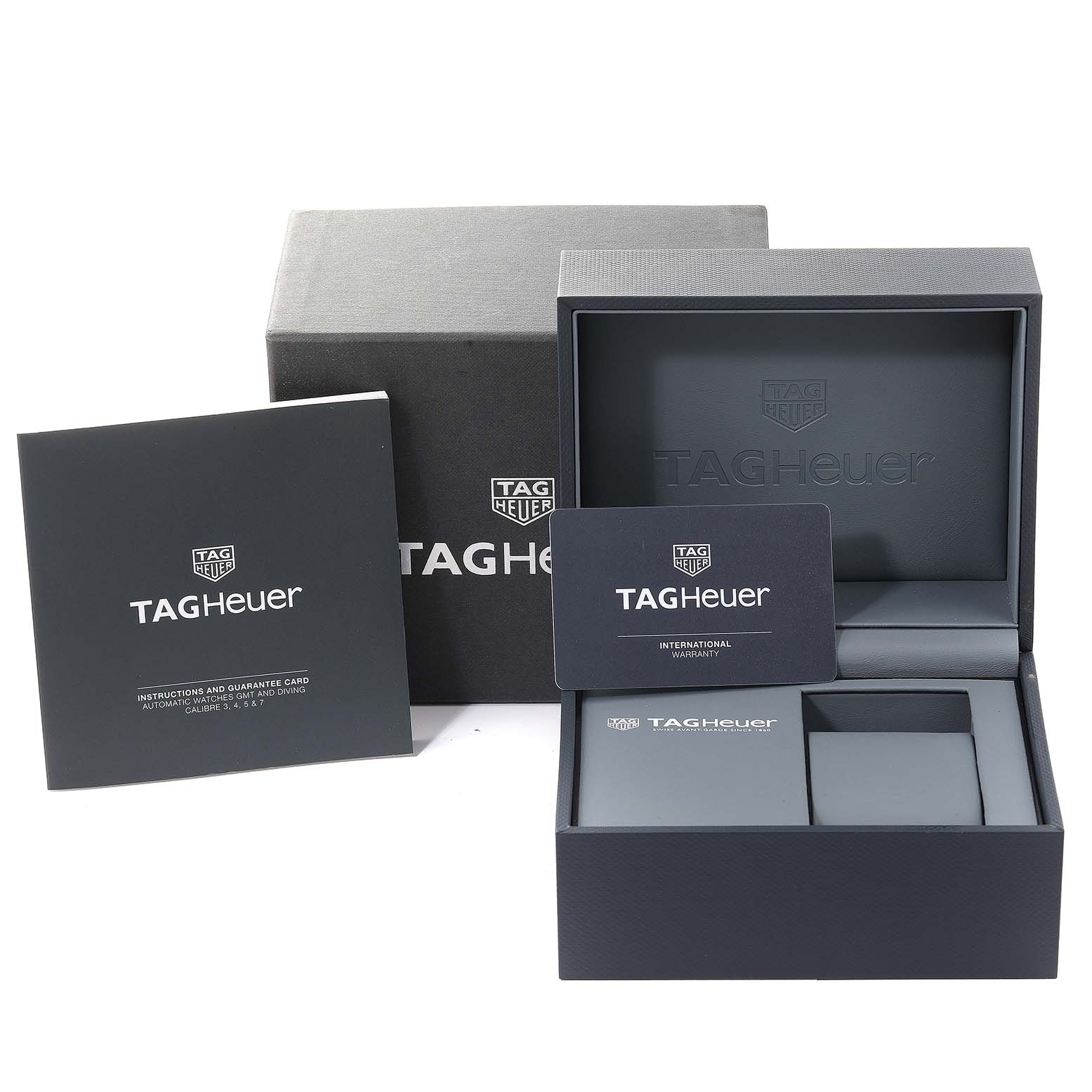The image shows the packaging, international warranty card, and instruction manual for a Tag Heuer Aquaracer WAY201A.BA0927 Men's Stainless Steel Black Dial WAY201A.BA0927 Men's Stainless Steel Black Dial watch.