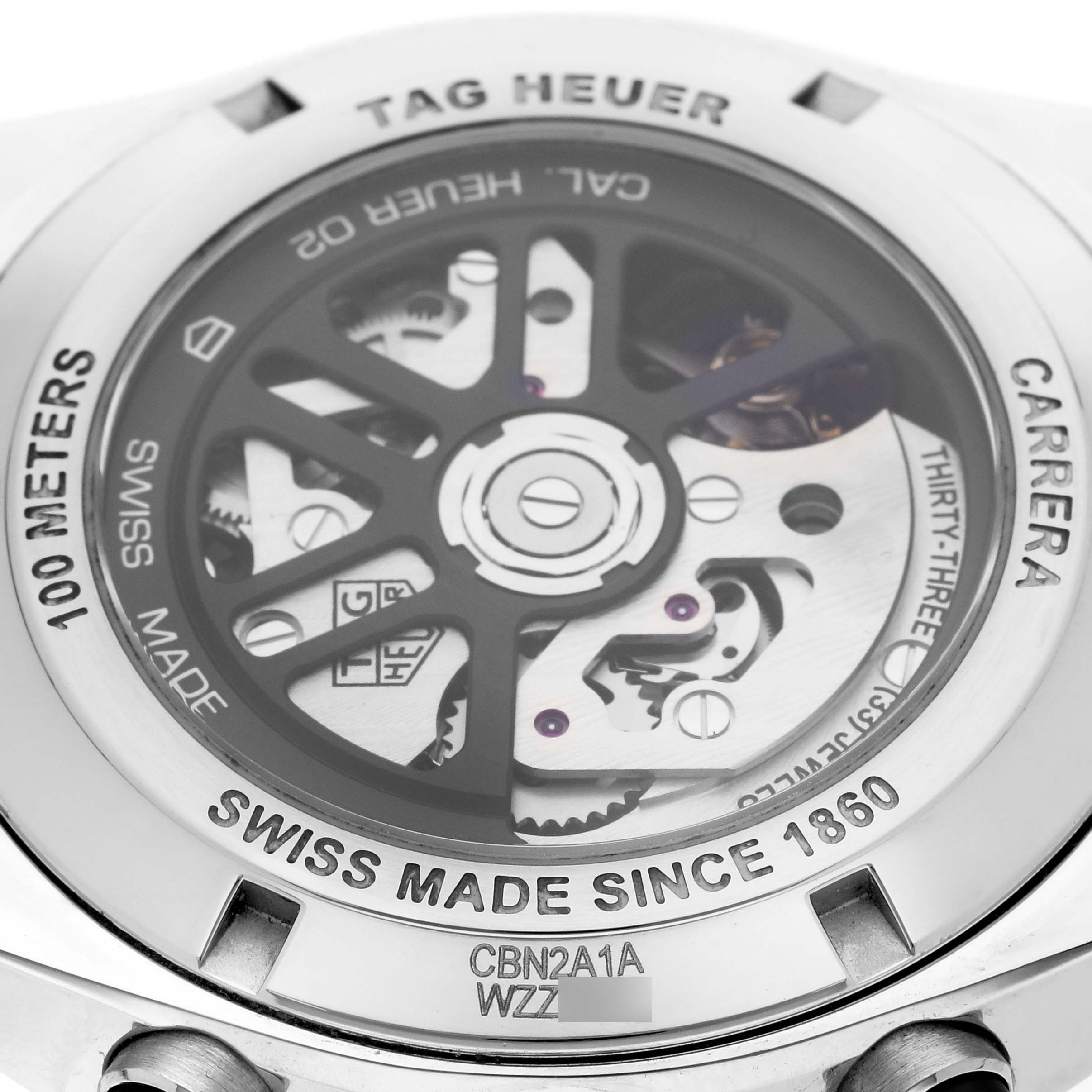 The image shows the back view of a Tag Heuer Carrera CBN2A1A Men's Stainless Steel Blue Dial CBN2A1A Men's Stainless Steel Blue Dial watch, focusing on the movement and engravings.