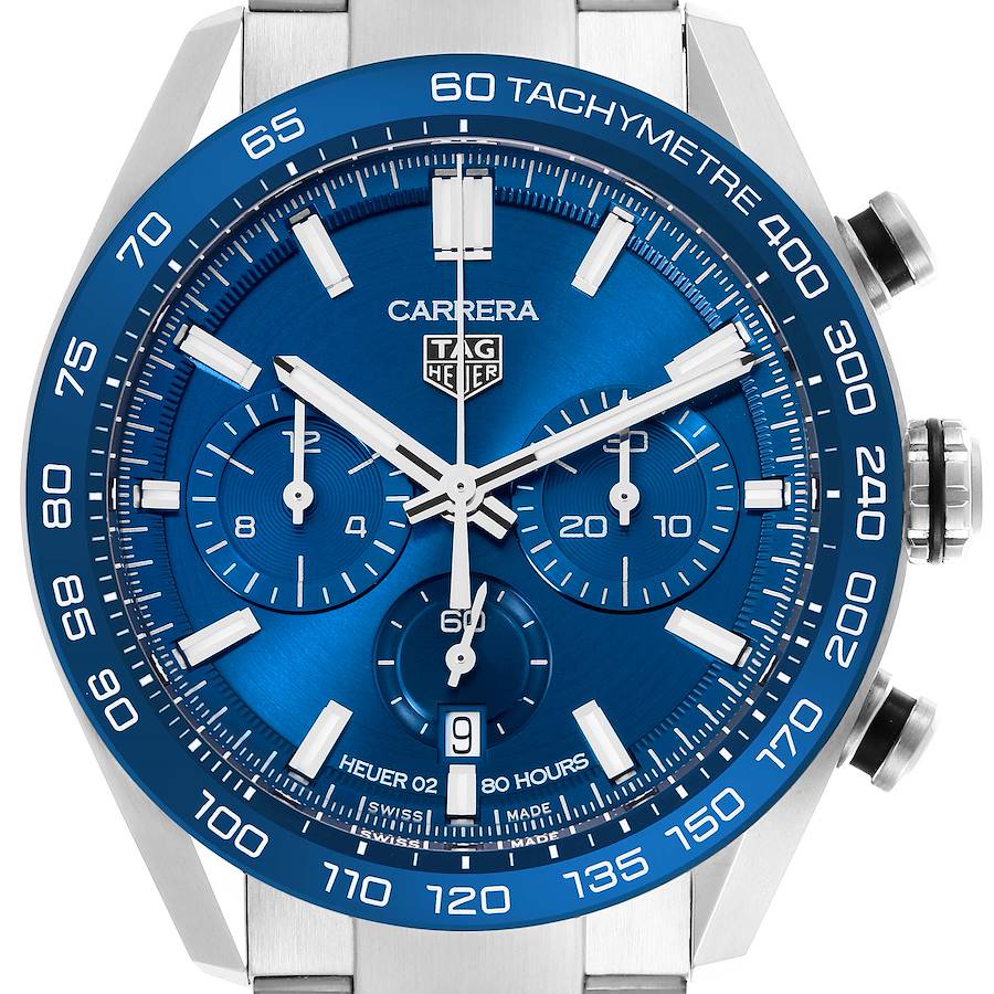 This Tag Heuer Carrera watch is shown from a frontal angle, displaying its blue dial, tachymeter, and chronograph subdials.