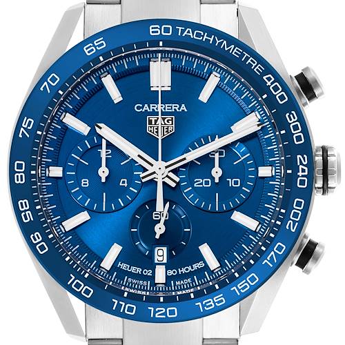 The Tag Heuer Carrera watch is shown from a front angle, highlighting the blue dial and tachymeter bezel.