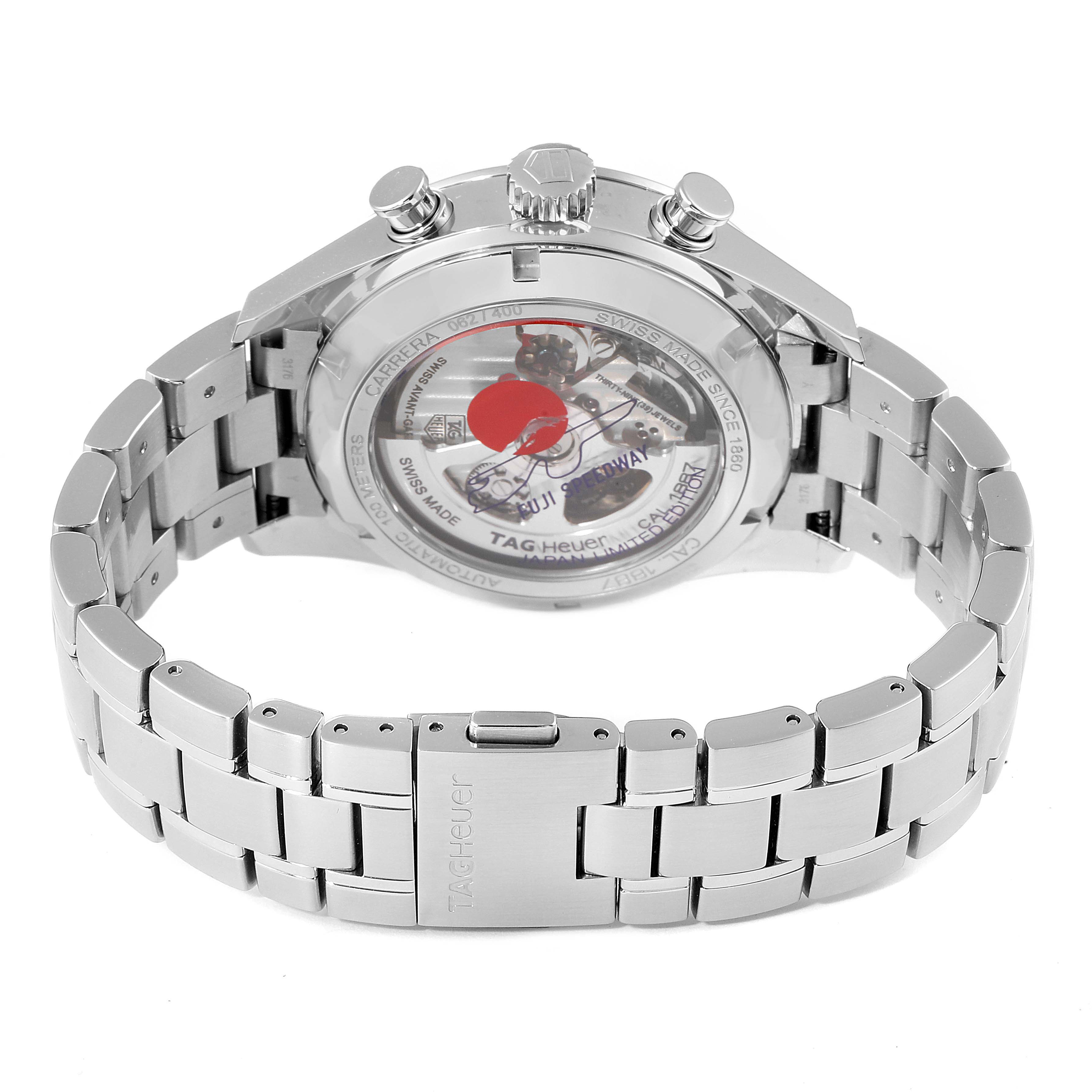 The image shows the back view of a Tag Heuer Carrera watch, highlighting the movement and stainless steel bracelet.