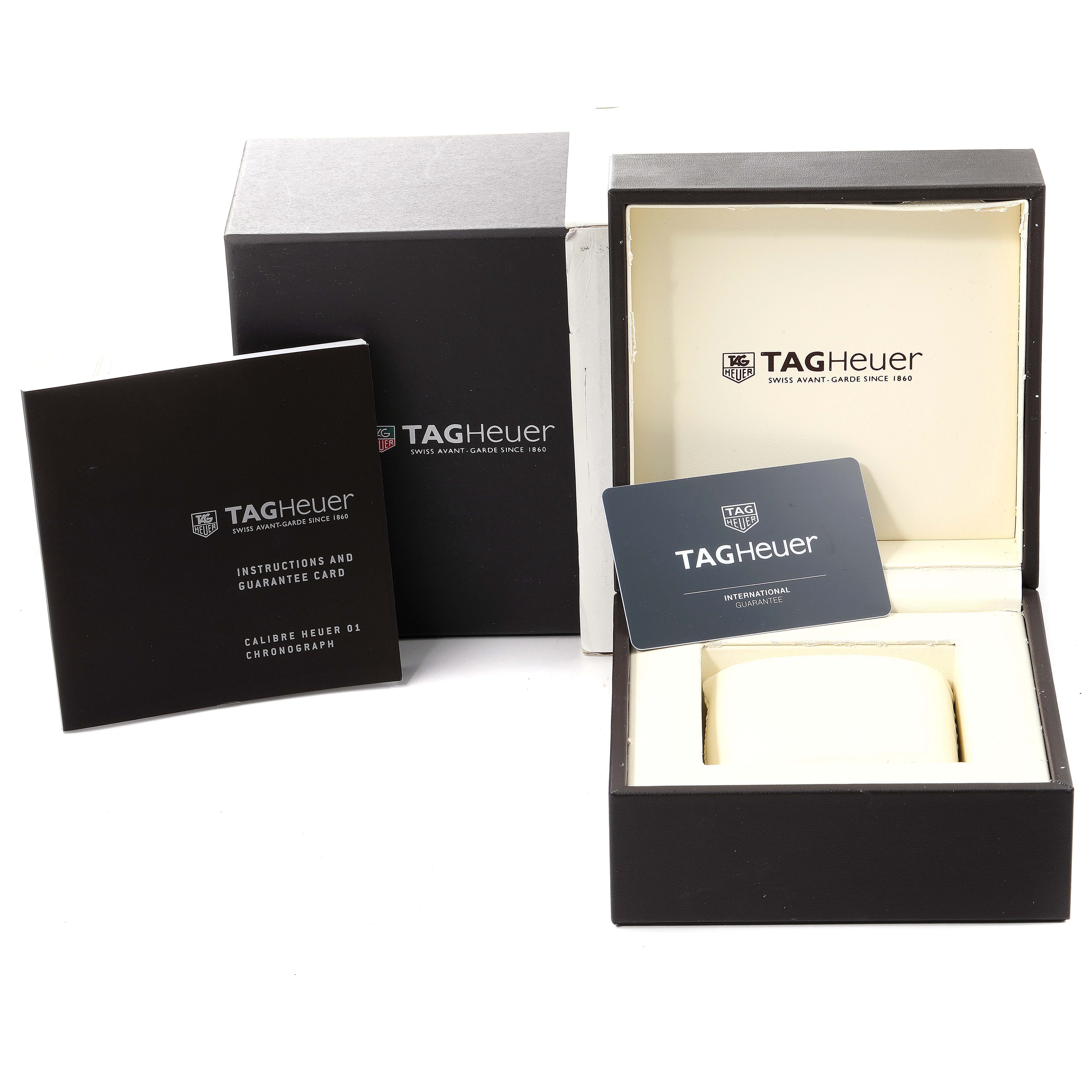 The image shows the packaging, instruction manual, and guarantee card for the Tag Heuer Carrera CAR2A1W.BA0703 Men's Stainless Steel Transparent Dial CAR2A1W.BA0703 Men's Stainless Steel Transparent Dial model watch.