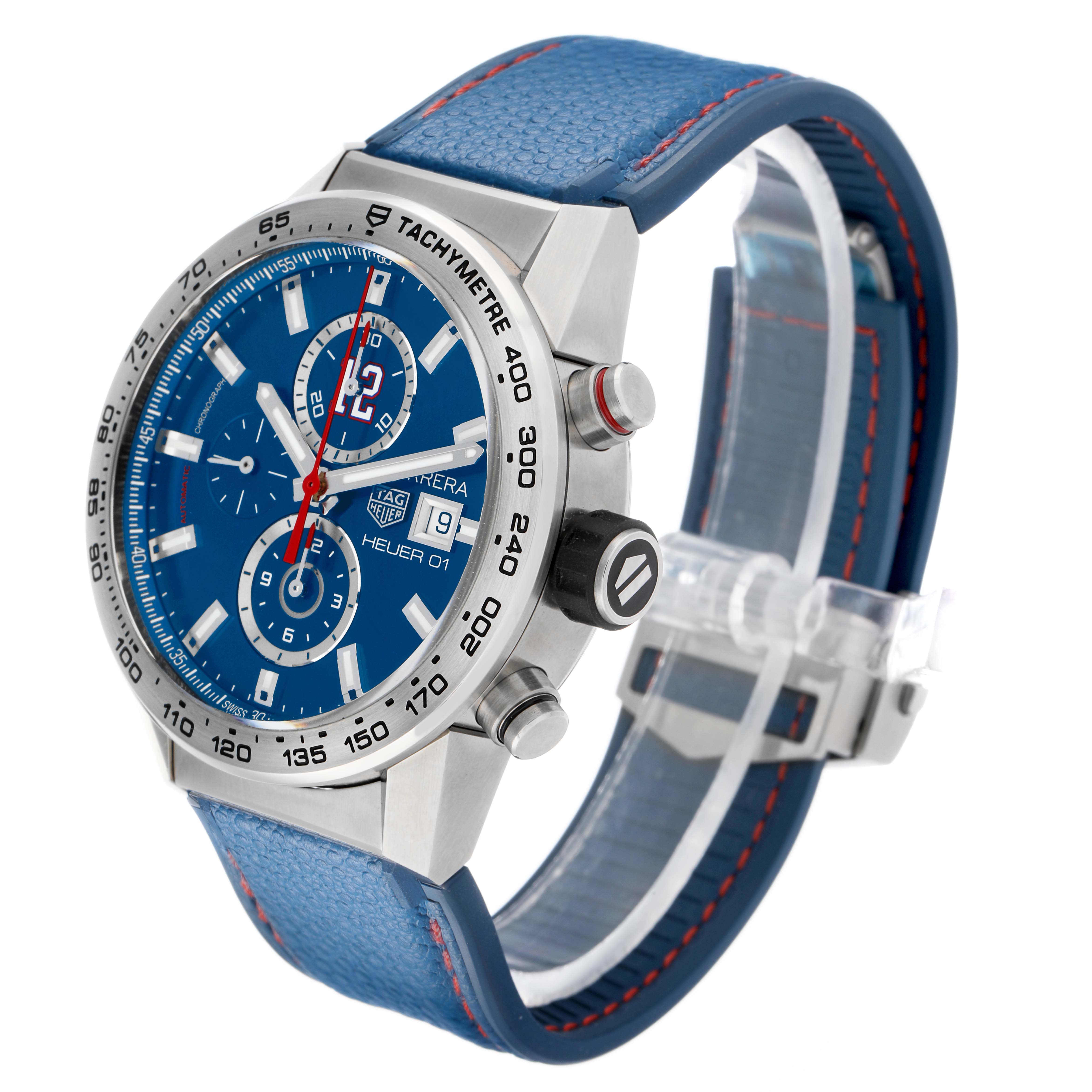 The watch is a Tag Heuer Carrera CAR201R Men's Stainless Steel Blue Dial model shown at a three-quarter angle, highlighting the blue dial, tachymeter bezel, and side pushers.