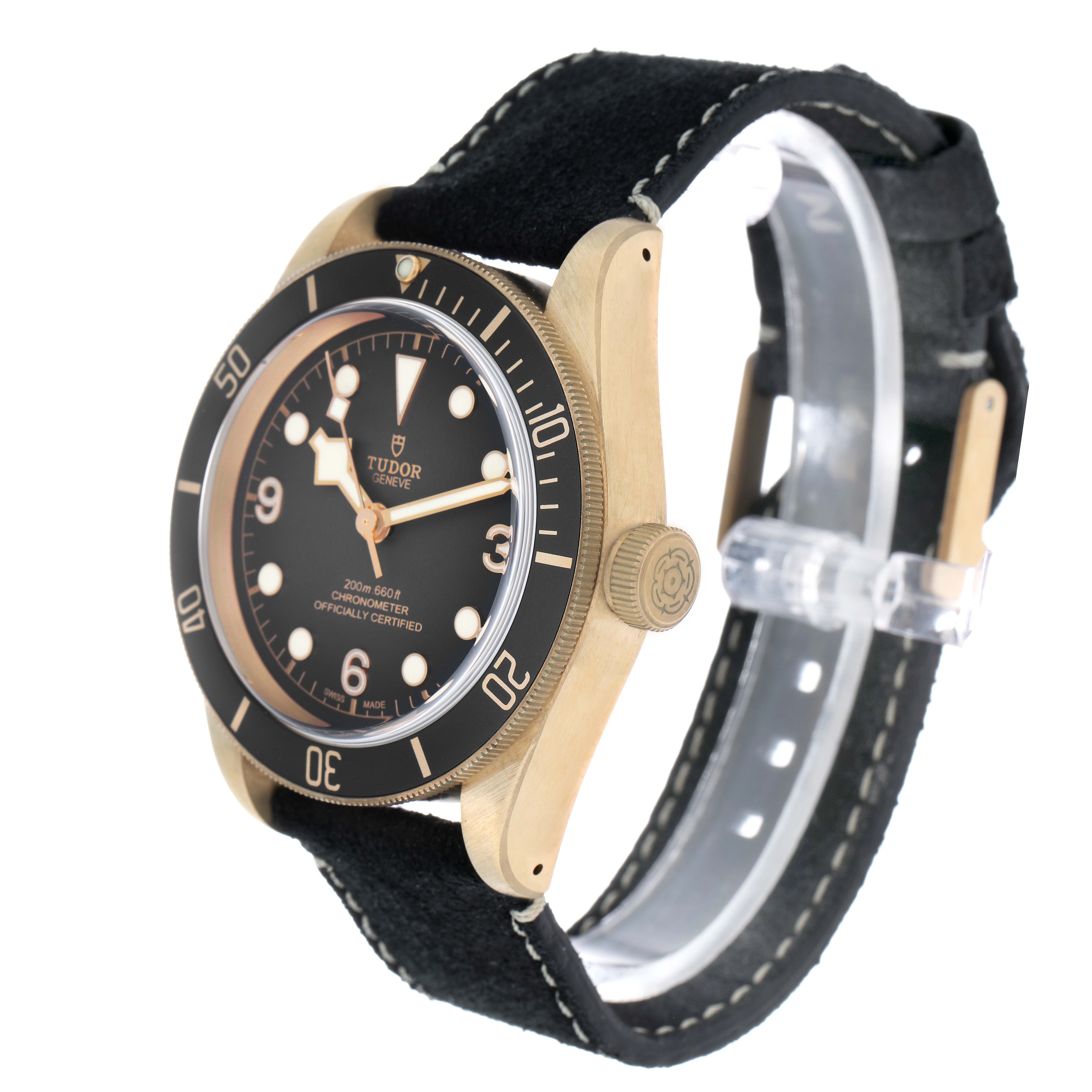 The Tudor Heritage Black Bay 79250 Men's Bronze Black Dial watch is shown at an angle highlighting the dial, case, crown, and strap.