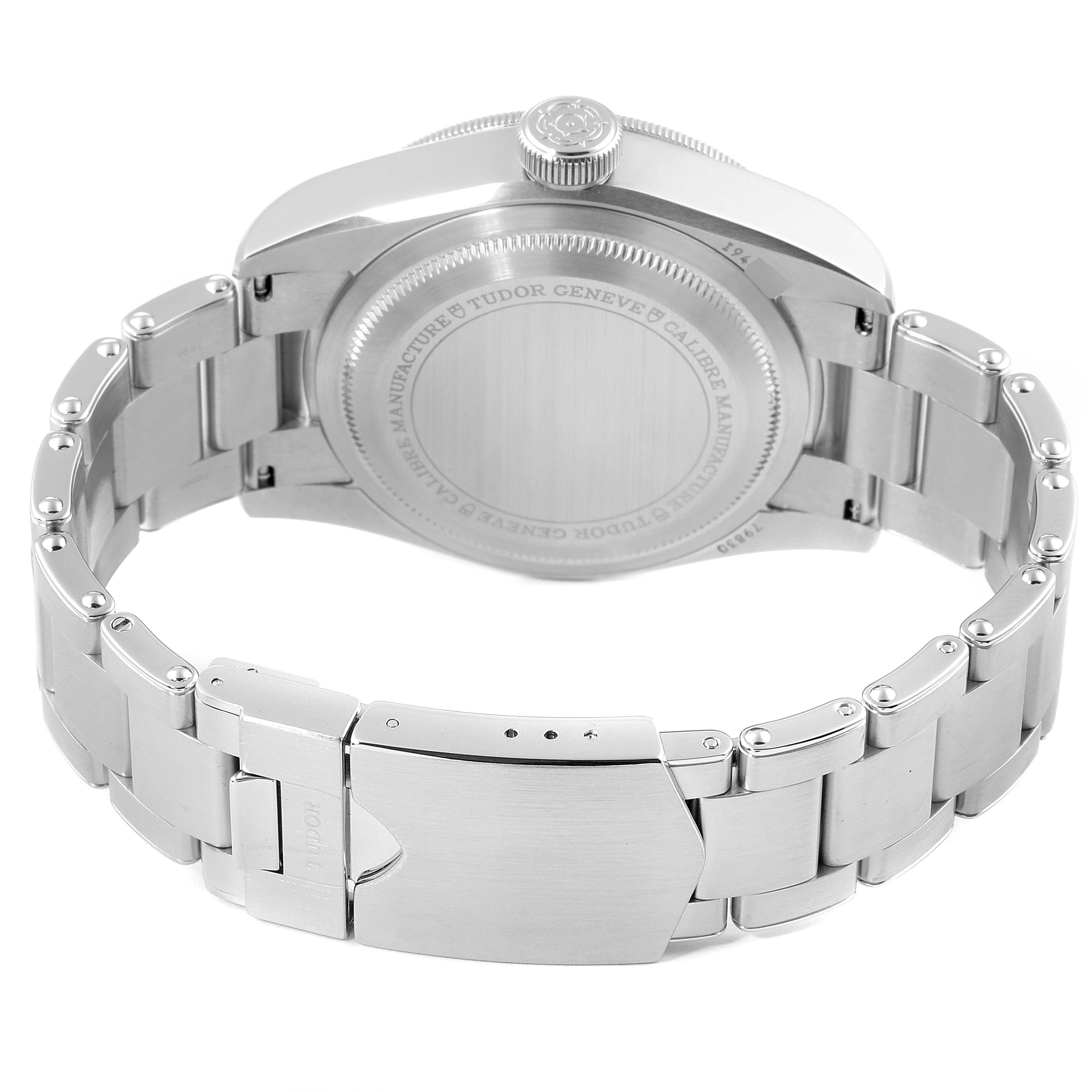 The image shows the back view of a Tudor Heritage Black Bay 79830RB Men
s Stainless Steel Black Dial 79830RB Men
s Stainless Steel Black Dial watch, displaying the case back and metal bracelet with the clasp.