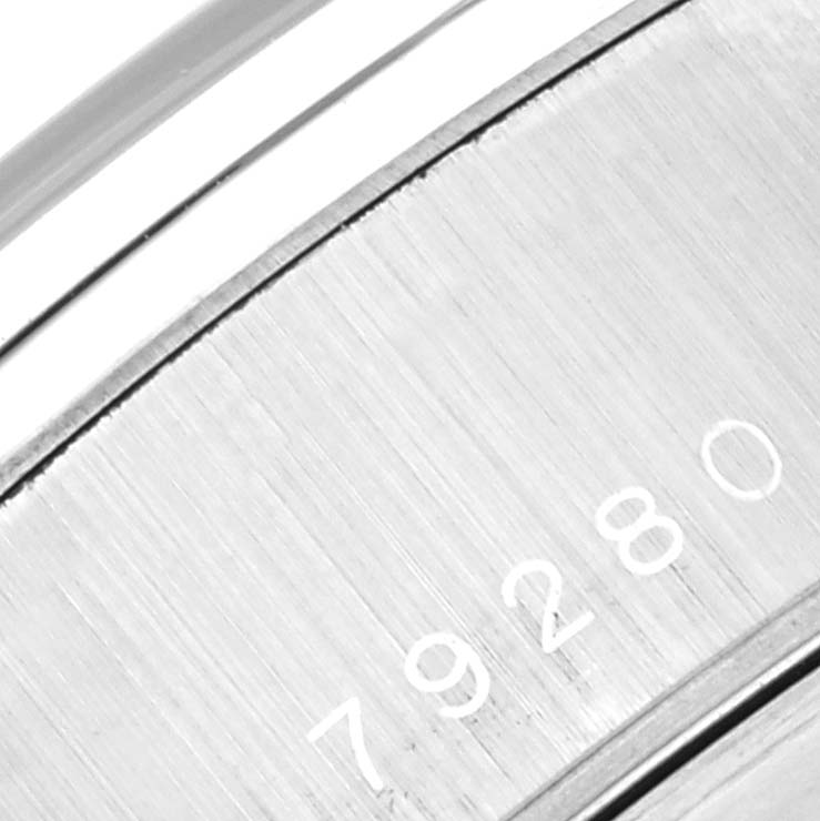 This image shows a close-up of the case back with the serial number of a Tudor Tiger 79280 Men's Stainless Steel Red Dial 79280 Men's Stainless Steel Red Dial model watch.