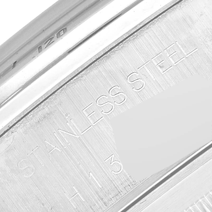 This image shows a close-up of the case back engraving of a Tudor Tiger 79280 Men's Stainless Steel Red Dial 79280 Men's Stainless Steel Red Dial model watch, highlighting "STAINLESS STEEL."