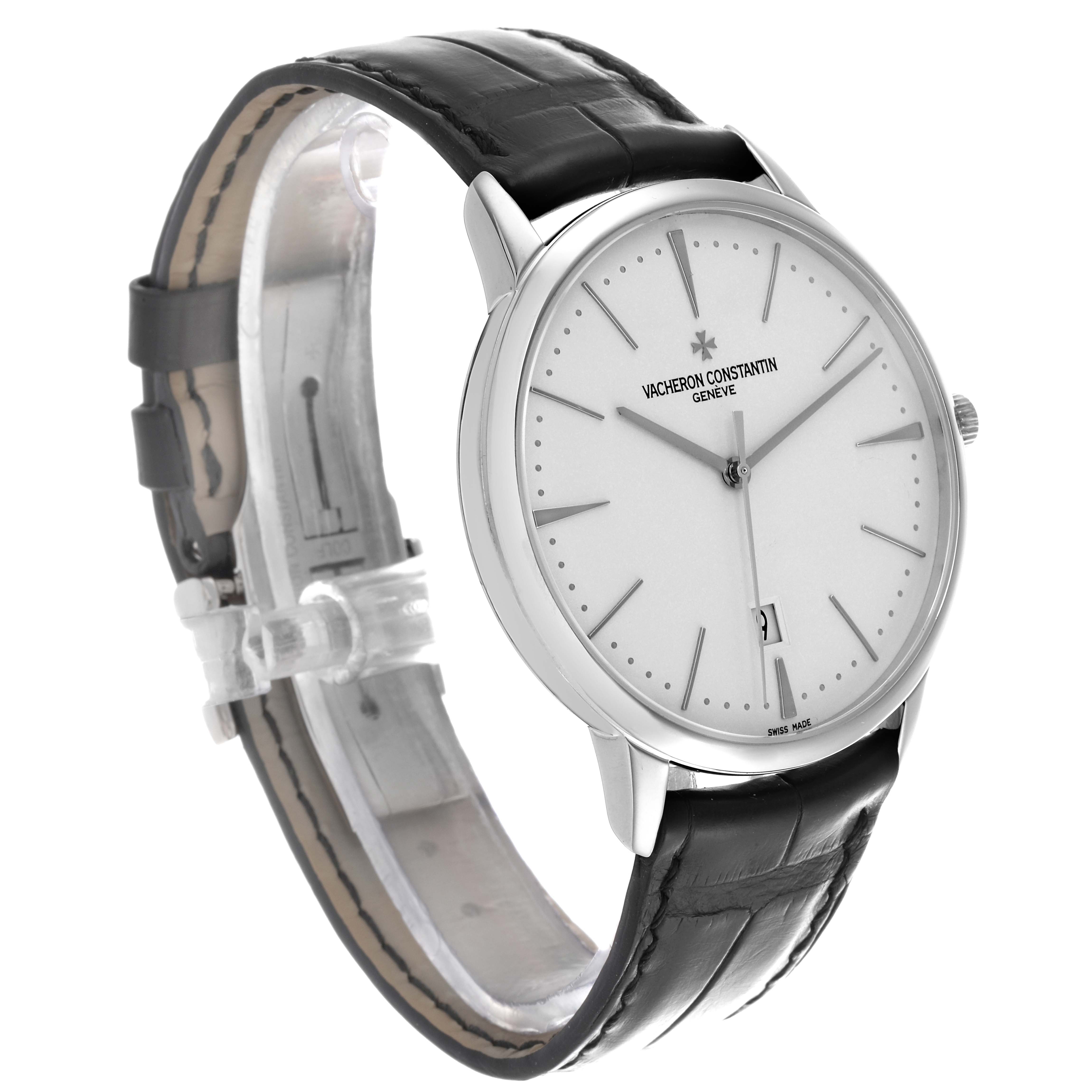 The Vacheron Constantin Patrimony 85180/000G-9230 Men's White Gold Silver Dial watch is shown at a tilted angle, highlighting the face, black leather strap, and silver case.