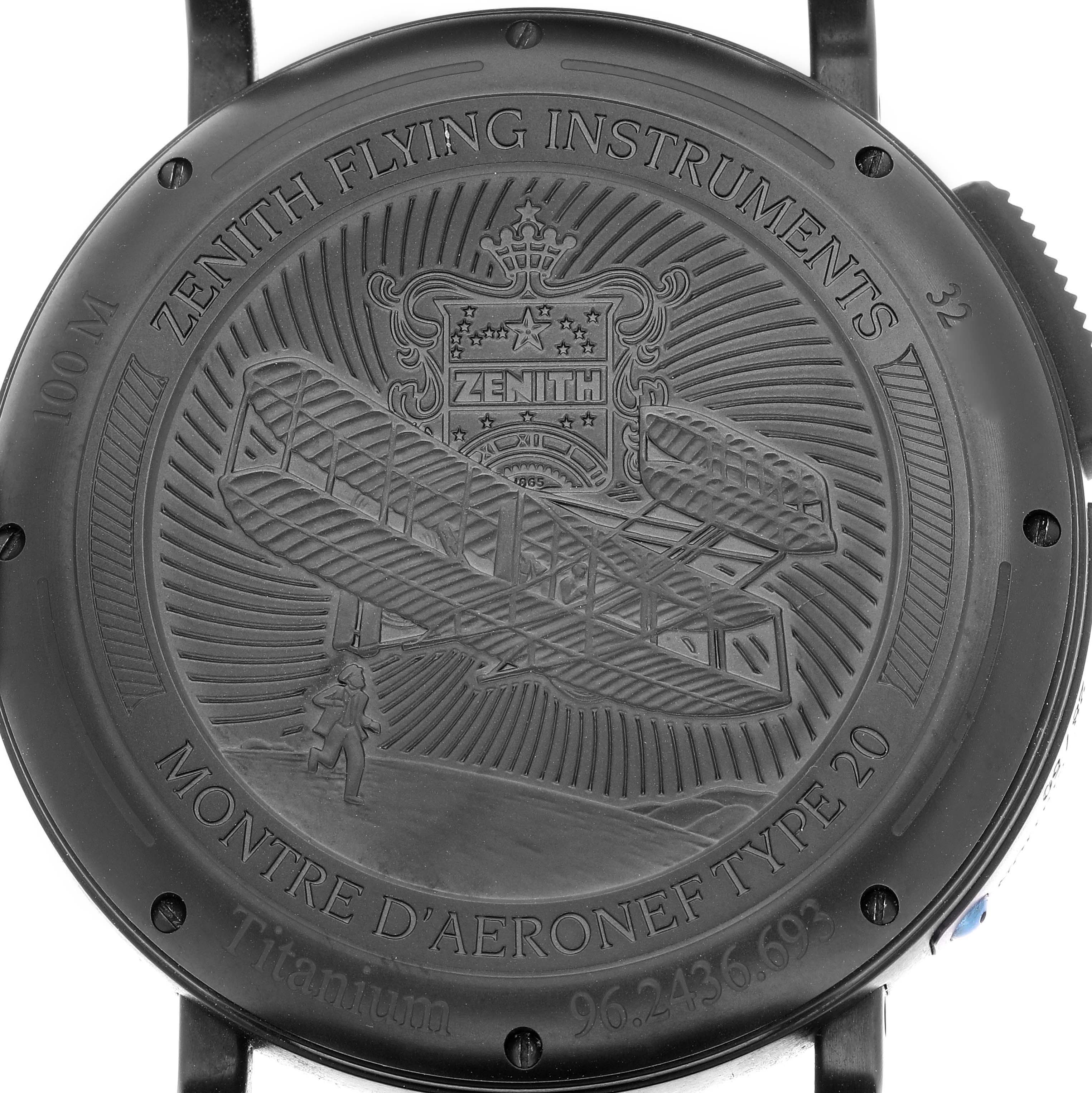 The image shows the engraved back case of a Zenith Pilot 96.2436.693 Men's Titanium Blue Dial watch, displaying aviation-themed designs.