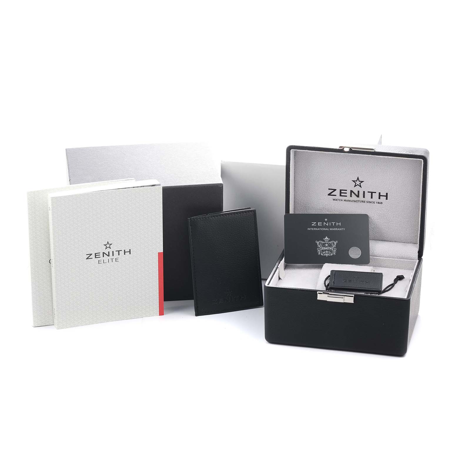 The image shows the packaging and accessories for a Zenith Pilot 96.2436.693 Men's Titanium Blue Dial watch, including a box, documents, and warranty card.