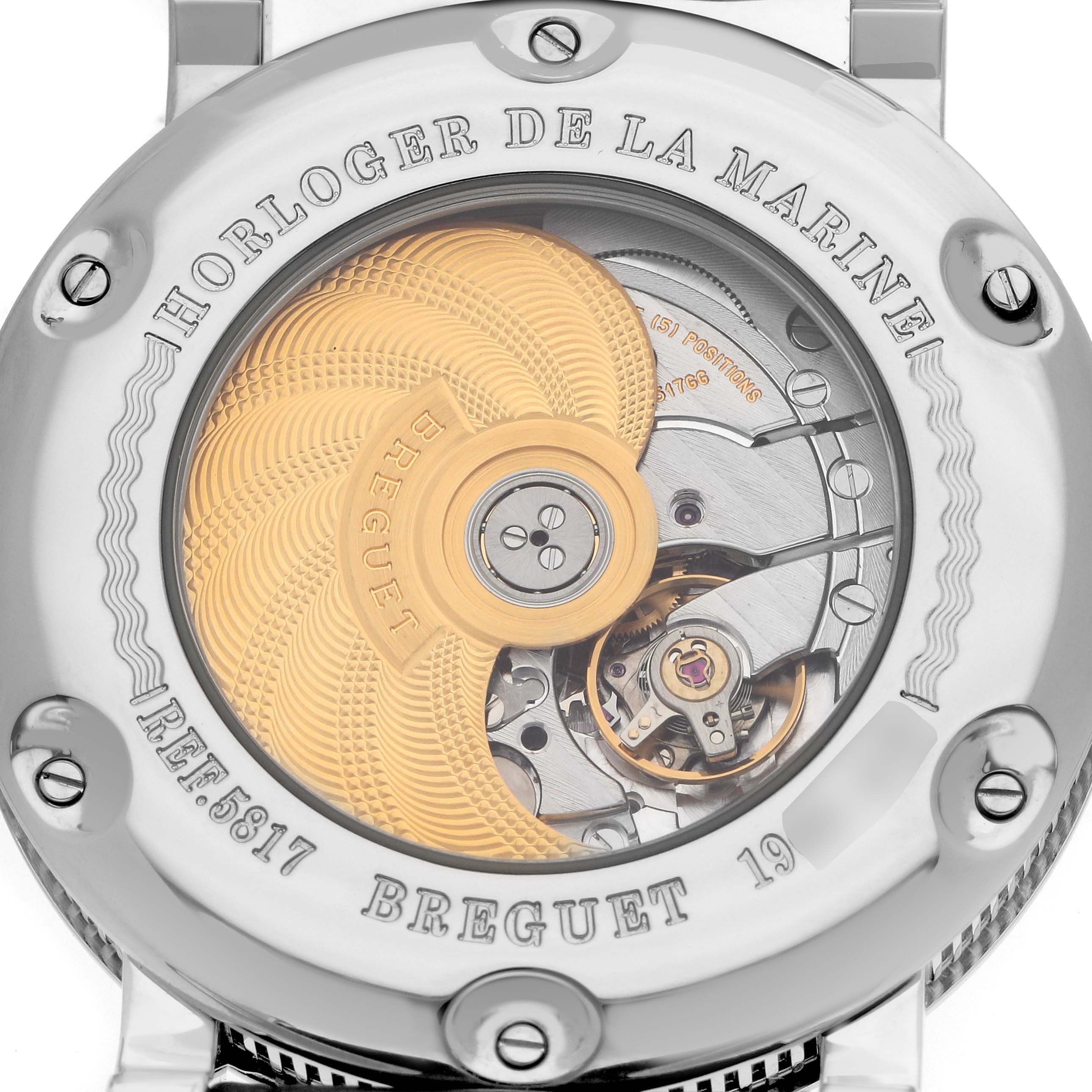 The image shows the back of a Breguet Marine 5817BR Men's Stainless Steel Black Dial watch with its intricate movement and engraved rotor visible.