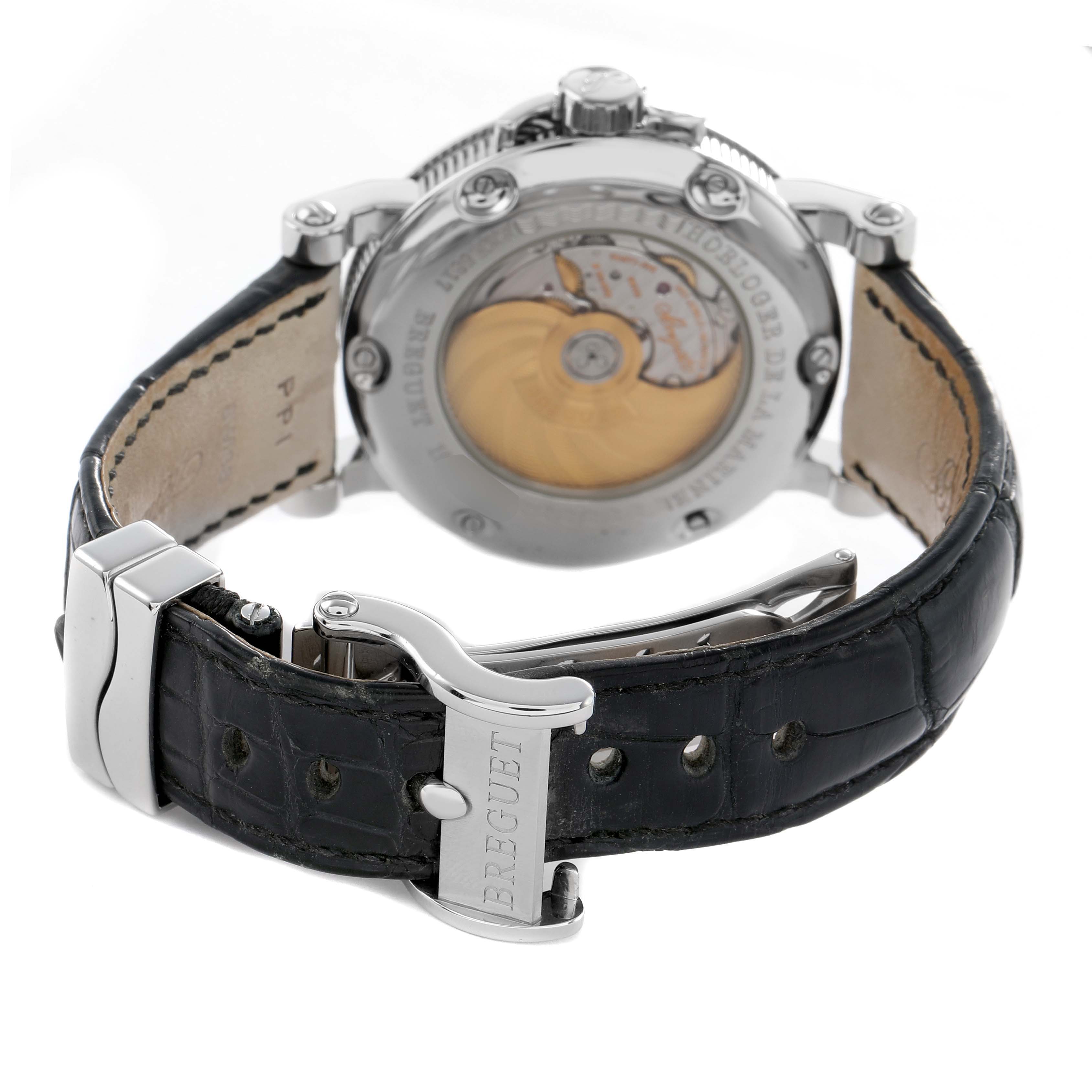 The Breguet Marine 5817BR Men's Stainless Steel Black Dial watch is shown from the back, highlighting the open case back and leather strap with the Breguet clasp.