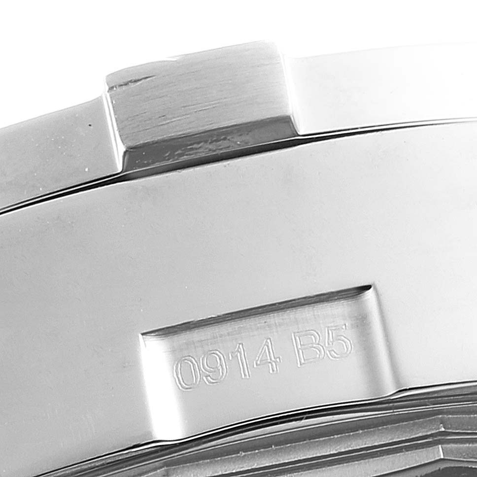 This image shows a close-up of the metal strap with engraved markings on a Breitling Avenger A13381 Men's Stainless Steel White Dial A13381 Men's Stainless Steel White Dial watch.