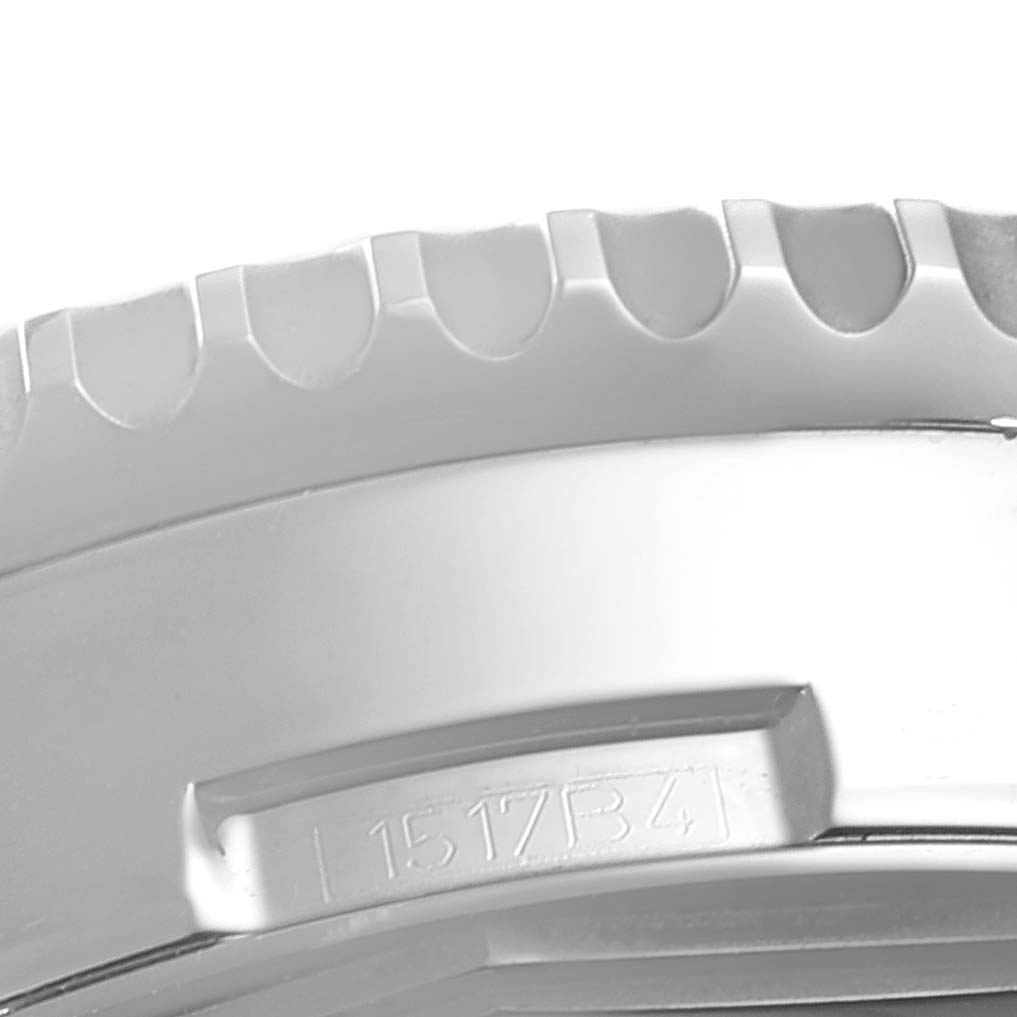 This close-up view shows a portion of the bezel and side of a Breitling Navitimer AB012721-C889-453A Men's Stainless Steel Blue Dial AB012721-C889-453A Men's Stainless Steel Blue Dial watch.