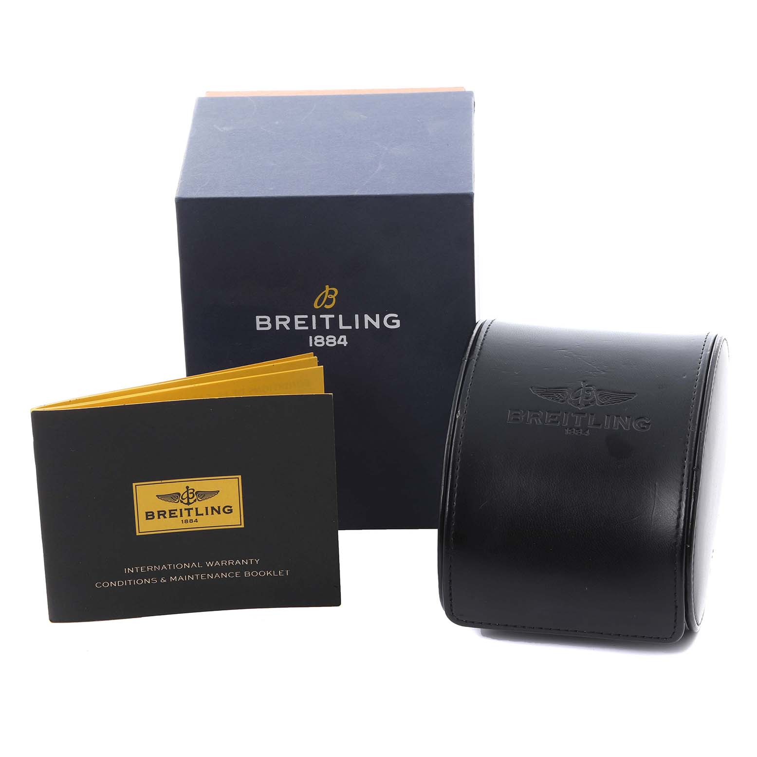 The image shows the Breitling Superocean A17366 Men
s Stainless Steel White Dial A17366 Men
s Stainless Steel White Dial watch
s packaging, including a box, a leather case, and a warranty booklet.