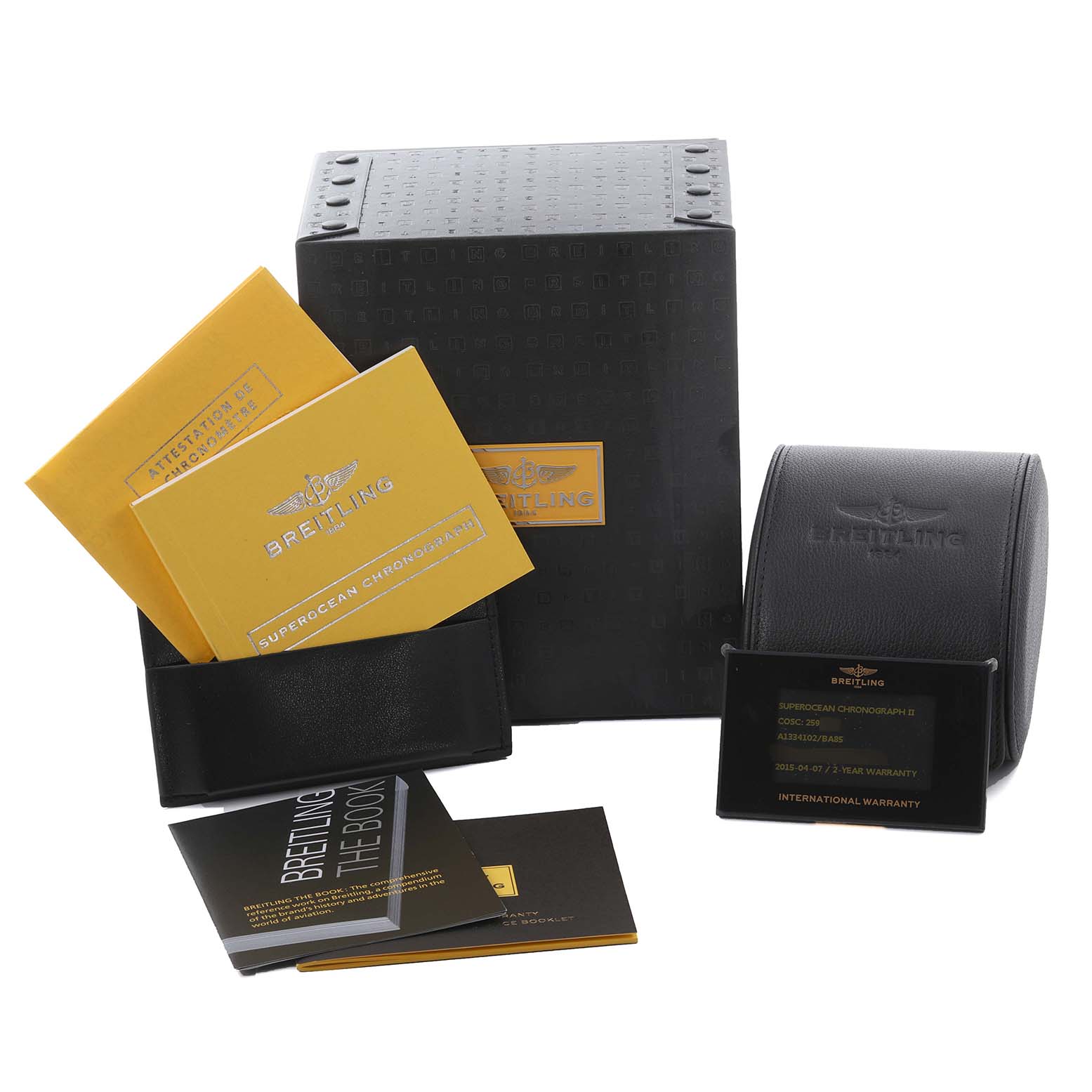 This image shows packaging and documentation for the Breitling Superocean A1334102/BA85 Men's Stainless Steel Black Dial A1334102/BA85 Men's Stainless Steel Black Dial model, including boxes, manuals, and warranty cards.