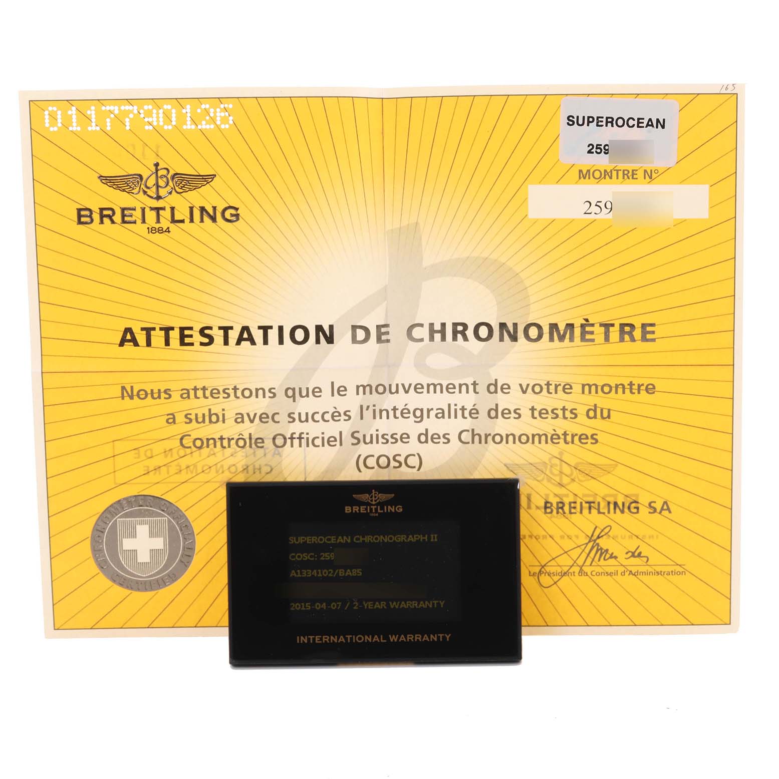The image shows the certification and warranty card for the Breitling Superocean A1334102/BA85 Men's Stainless Steel Black Dial A1334102/BA85 Men's Stainless Steel Black Dial watch model.
