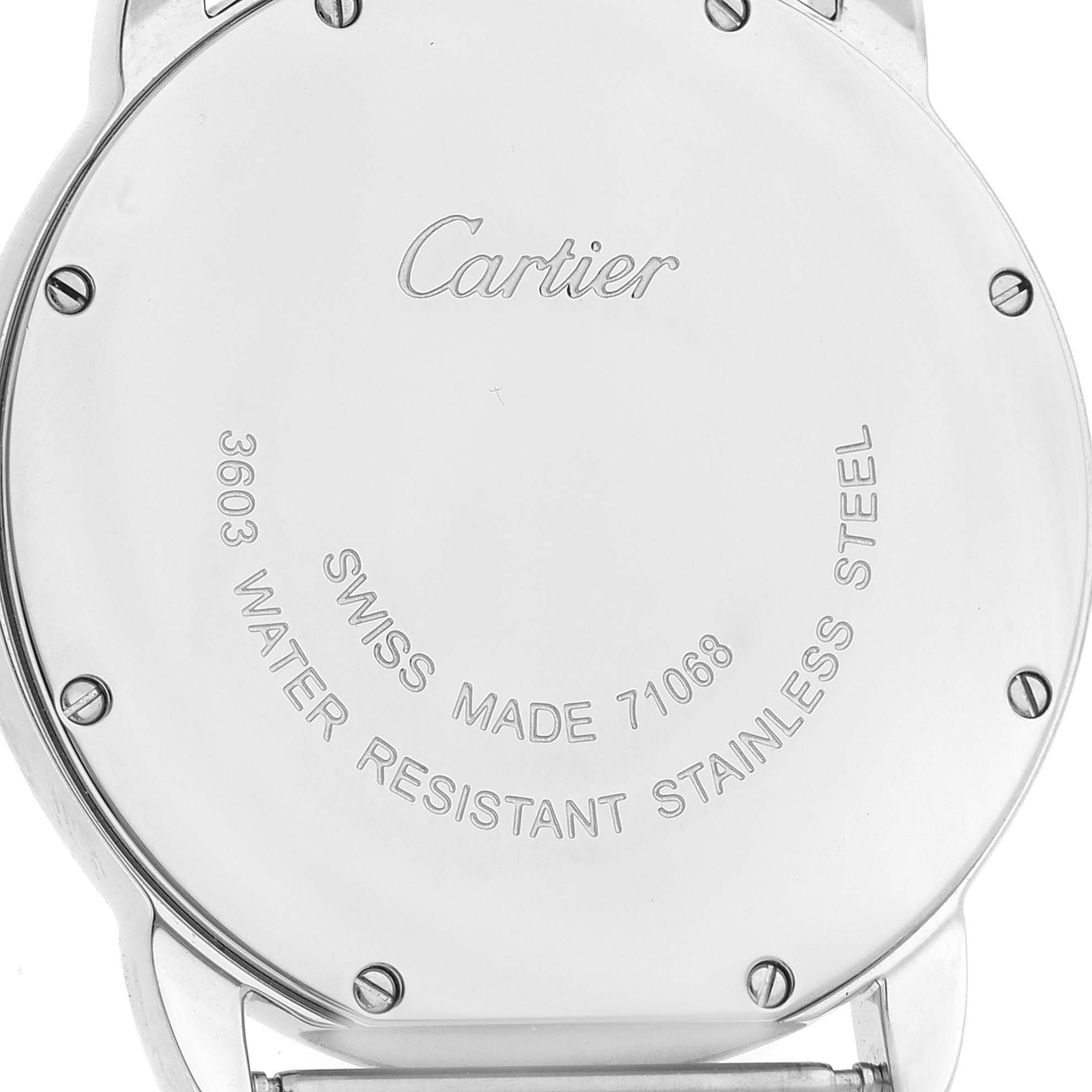 The image shows the back of a Cartier Ronde W6700255 Men's Stainless Steel Silver Dial W6700255 Men's Stainless Steel Silver Dial watch, highlighting the inscriptions and screws.