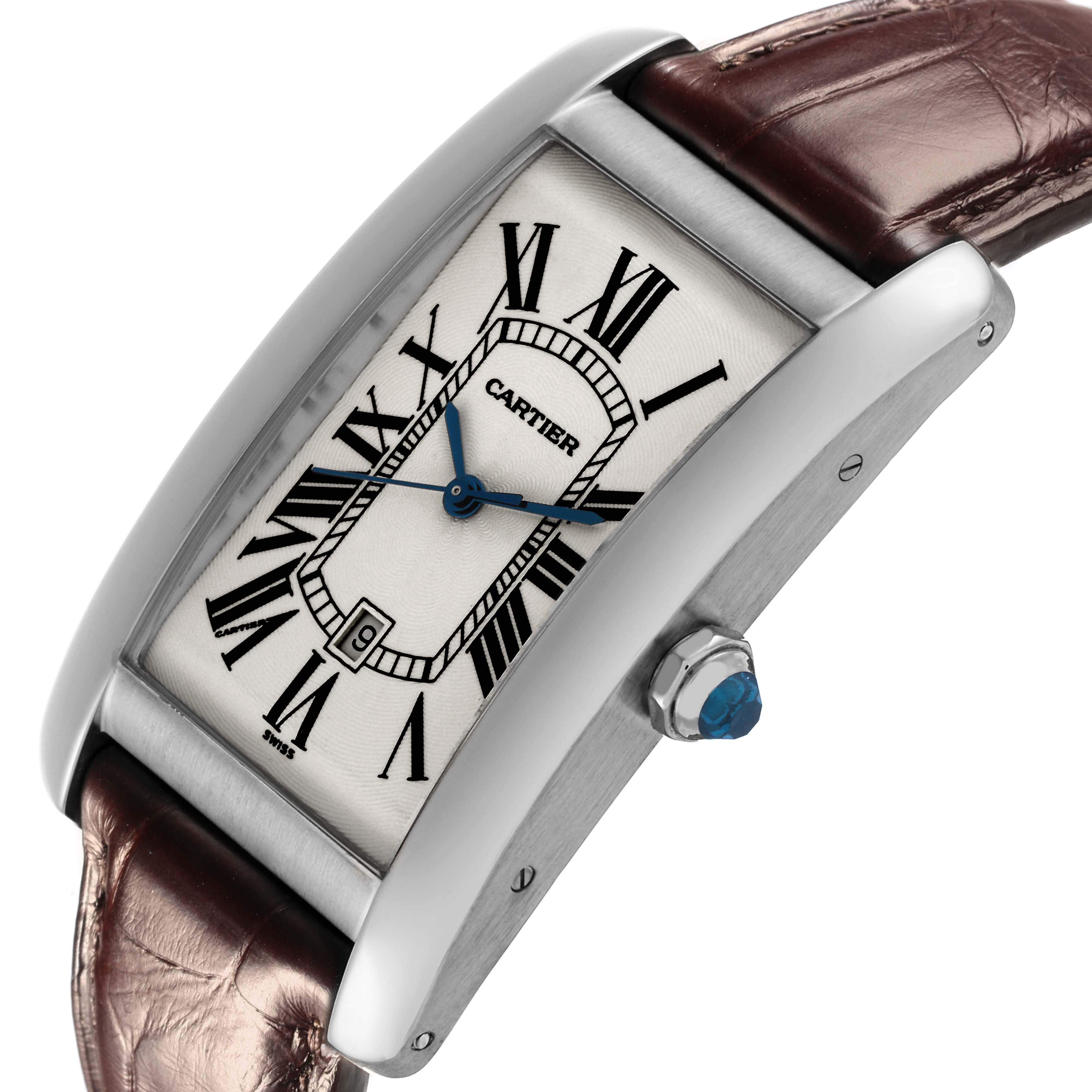 The Cartier Tank Américaine watch is shown from a side angle, highlighting the case, dial, crown, and brown strap.