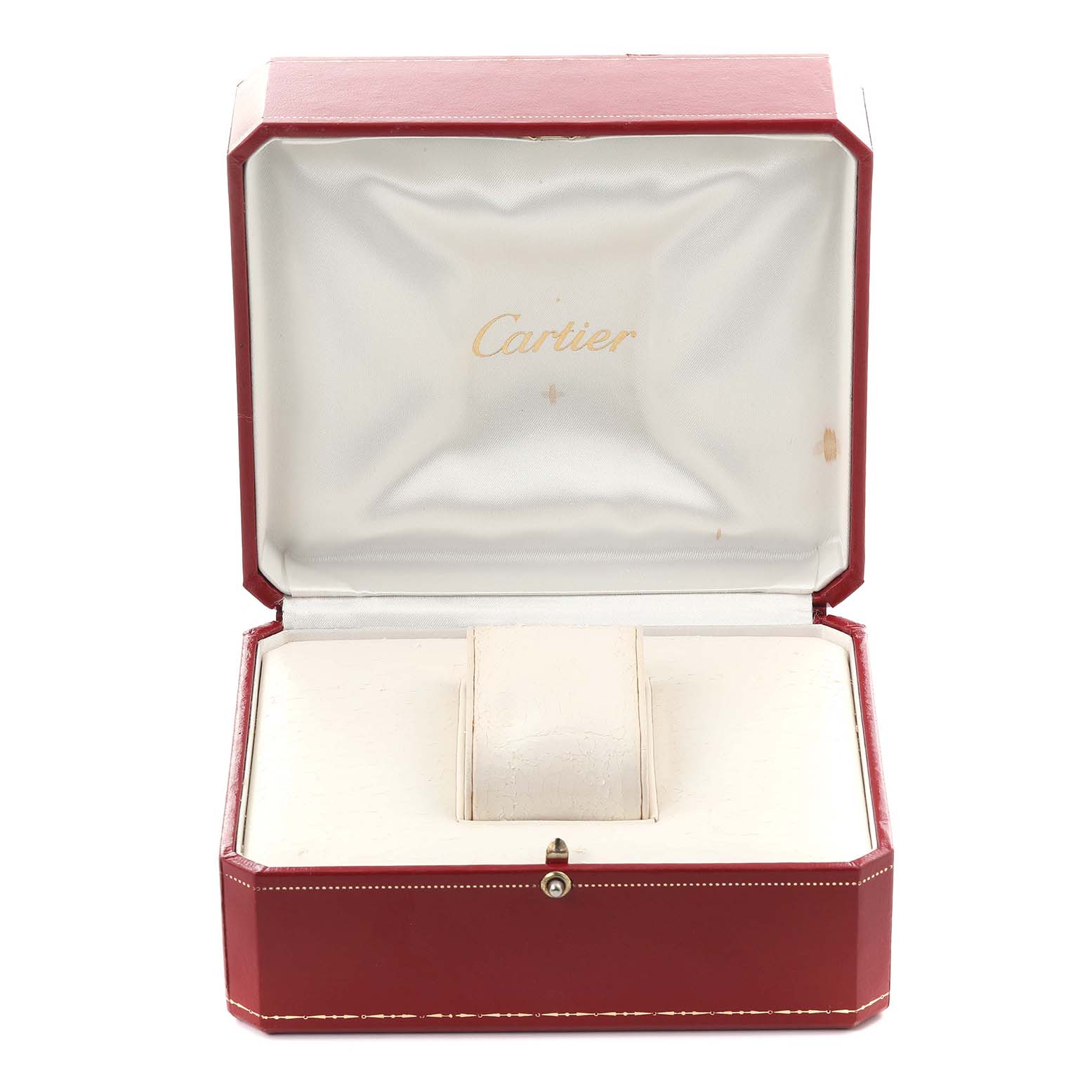 The image shows a red Cartier watch box for the Tank Americaine model, opened to display the cushioned interior.