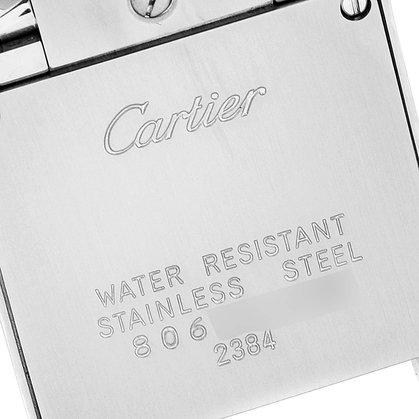 This image shows the back of a Cartier Tank Française watch, displaying the brand name and material details.