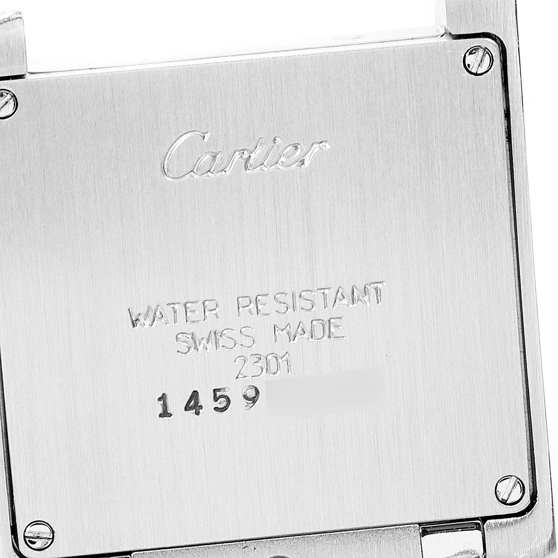 The image shows the back casing of a Cartier Tank Francaise WSTA0005 Women
s Stainless Steel Silver Dial WSTA0005 Women
s Stainless Steel Silver Dial watch, featuring brand engravings and model details.