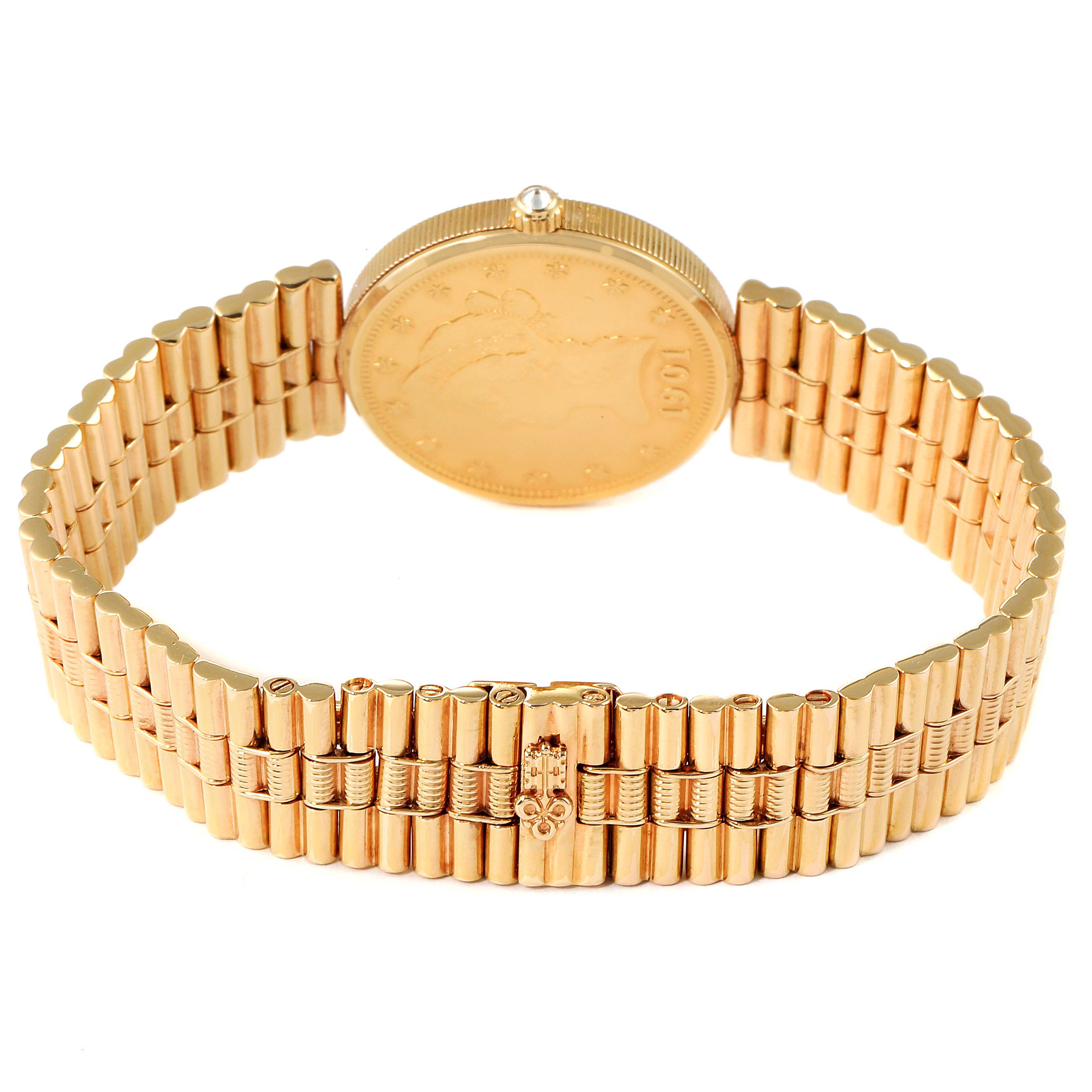 The image shows the Coin 10 Dollars Double Eagle Yellow Gold Ladies Watch 1901 model by Corum 1901 Women's Yellow Gold Black Dial 1901 Women's Yellow Gold Black Dial from the rear, highlighting the band and back of the case.