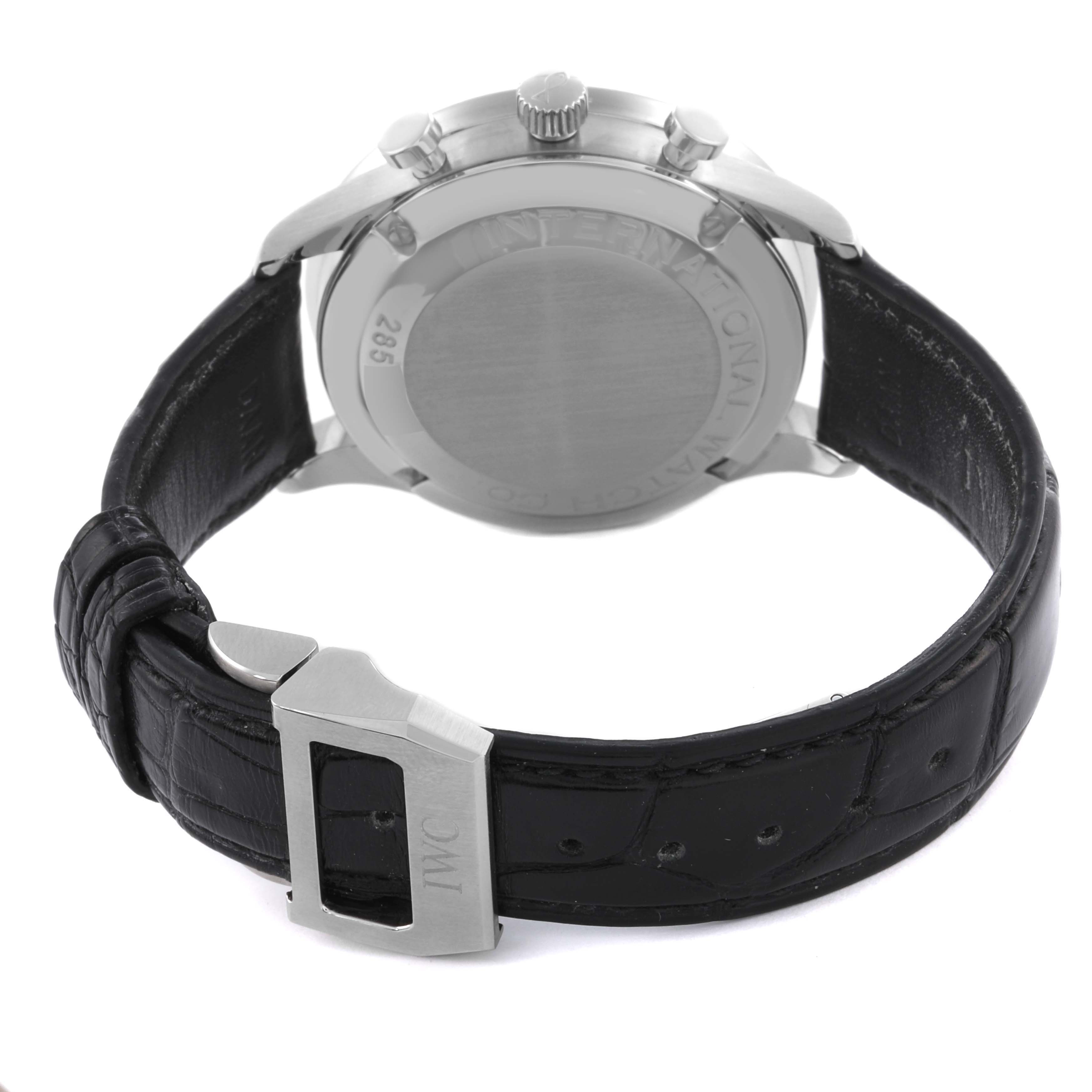 The IWC Portuguese IW371401 Men's Stainless Steel Silver Dial IW371401 Men's Stainless Steel Silver Dial watch is shown from the back, highlighting the case back, crown, and black leather strap with clasp.