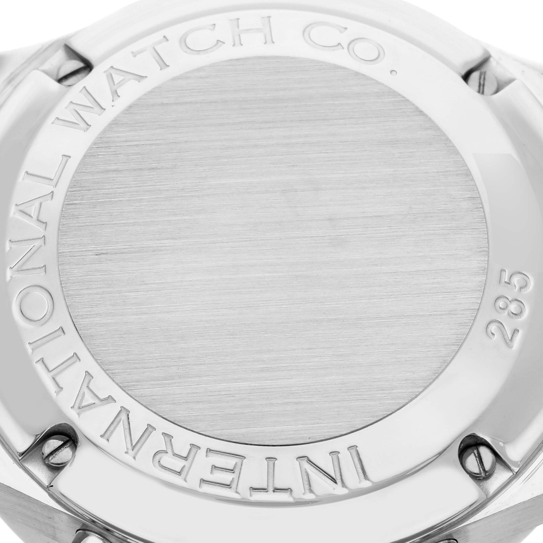 The image shows the back case of an IWC Portuguese IW371401 Men's Stainless Steel Silver Dial IW371401 Men's Stainless Steel Silver Dial watch, highlighting its engraved text and metal surface.