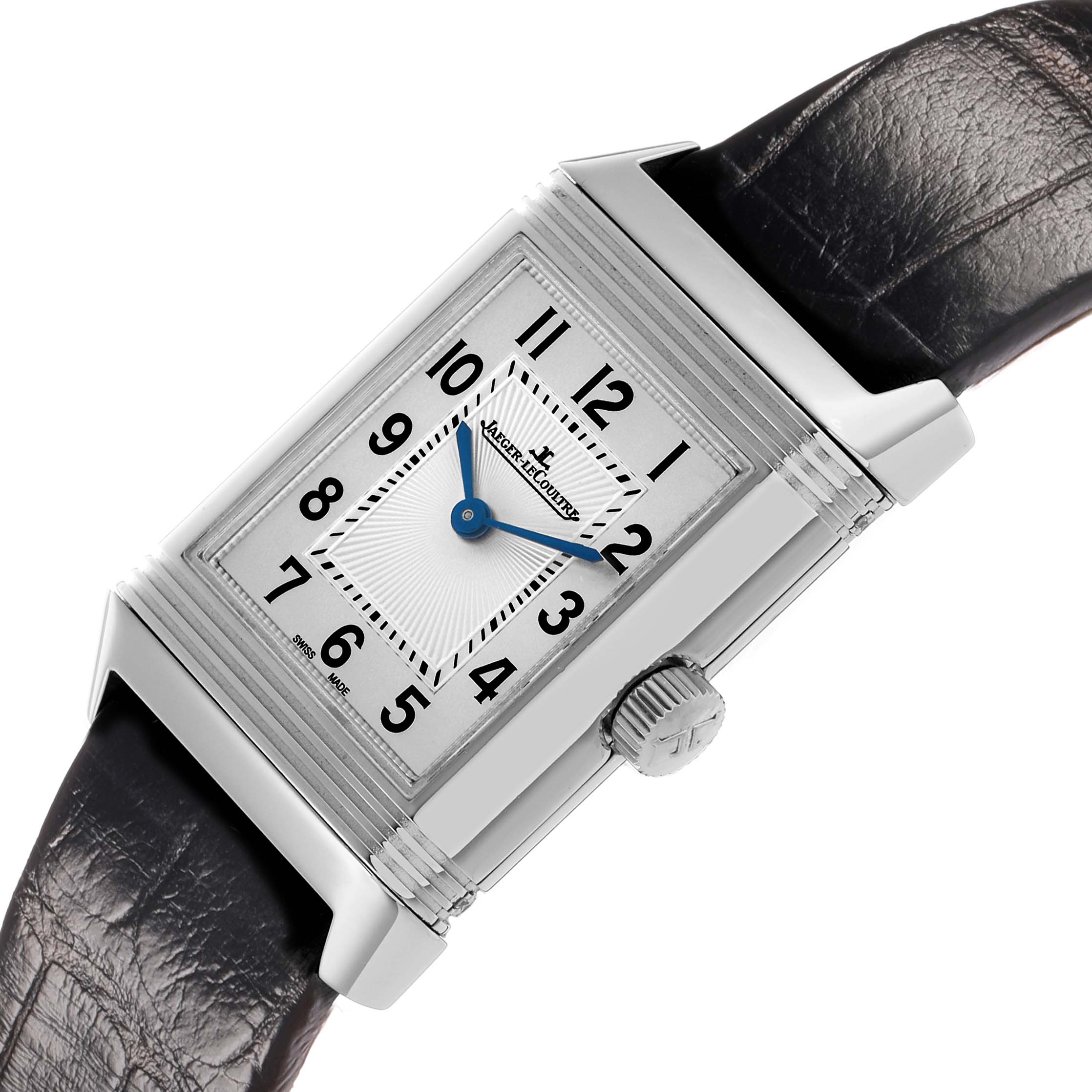 The Jaeger-LeCoultre Reverso watch is shown at a slight angle, displaying its rectangular face, numerals, and crown on the side.