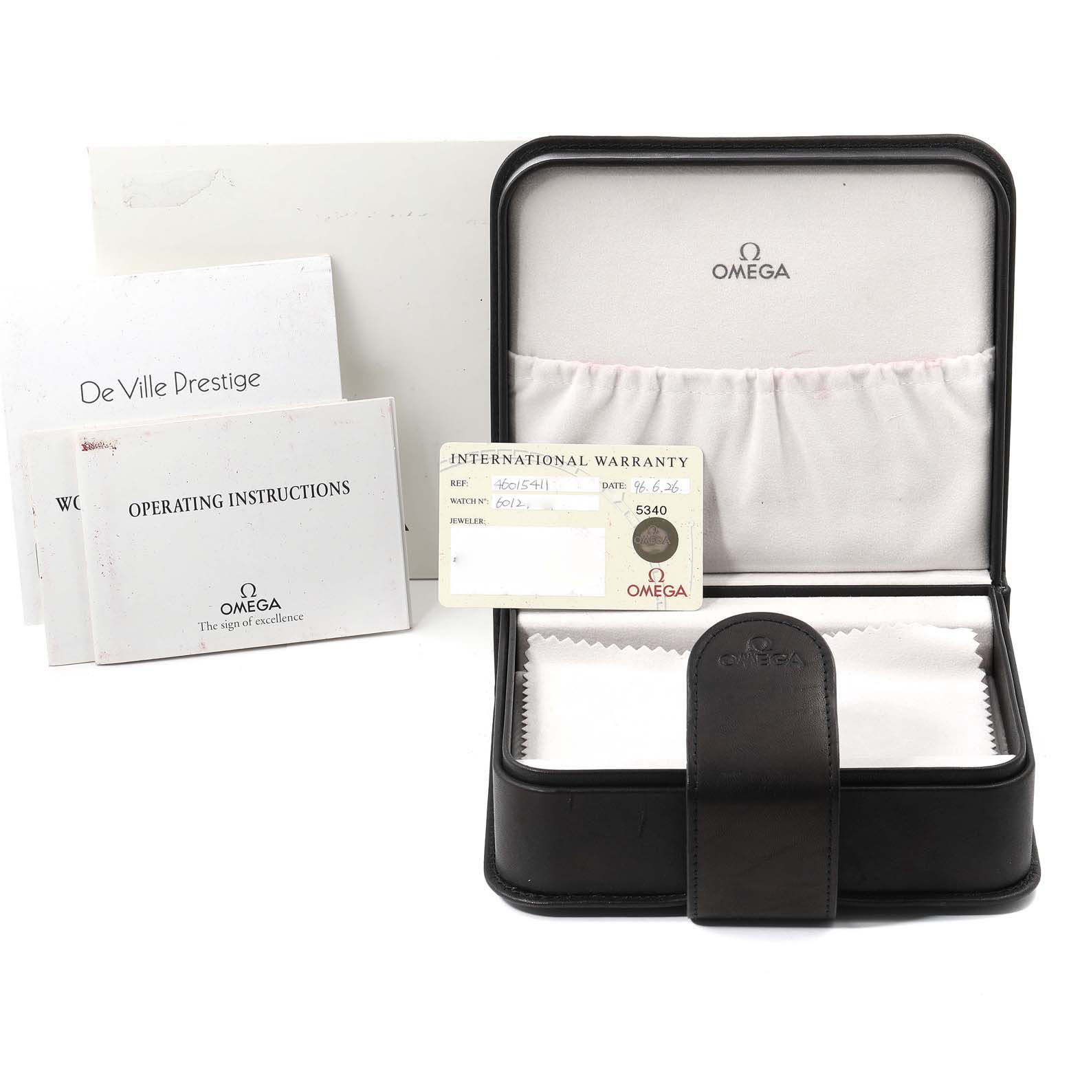 The image shows the packaging contents of an Omega De Ville 4601.54.11 Men's Rose Gold Black Dial 4601.54.11 Men's Rose Gold Black Dial watch, including the box, warranty card, and instruction manuals.