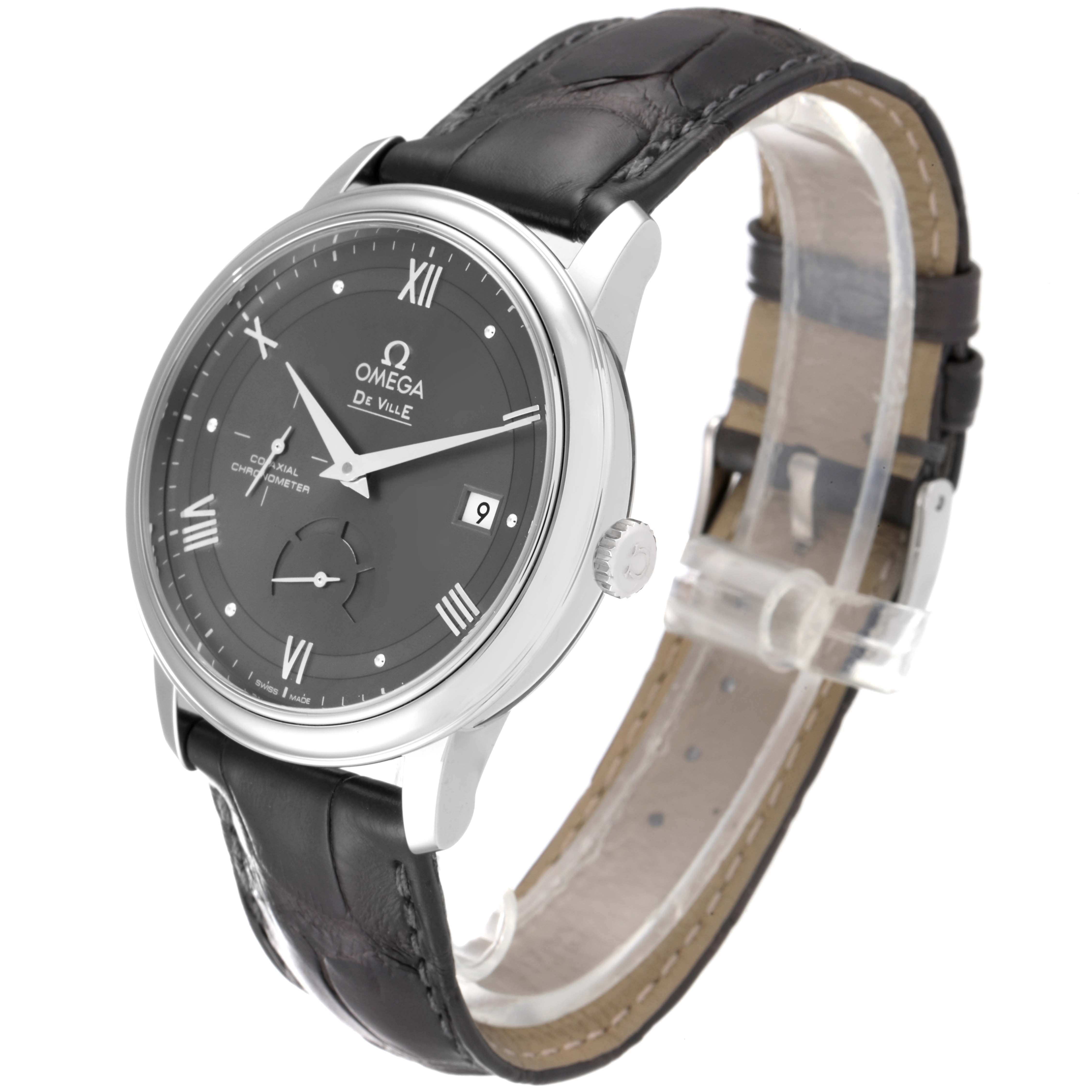 The Omega De Ville 424.13.40.21.06.001 Men
s Stainless Steel Grey Dial 424.13.40.21.06.001 Men
s Stainless Steel Grey Dial watch is shown at a three-quarter angle, displaying its face, crown, and leather strap.