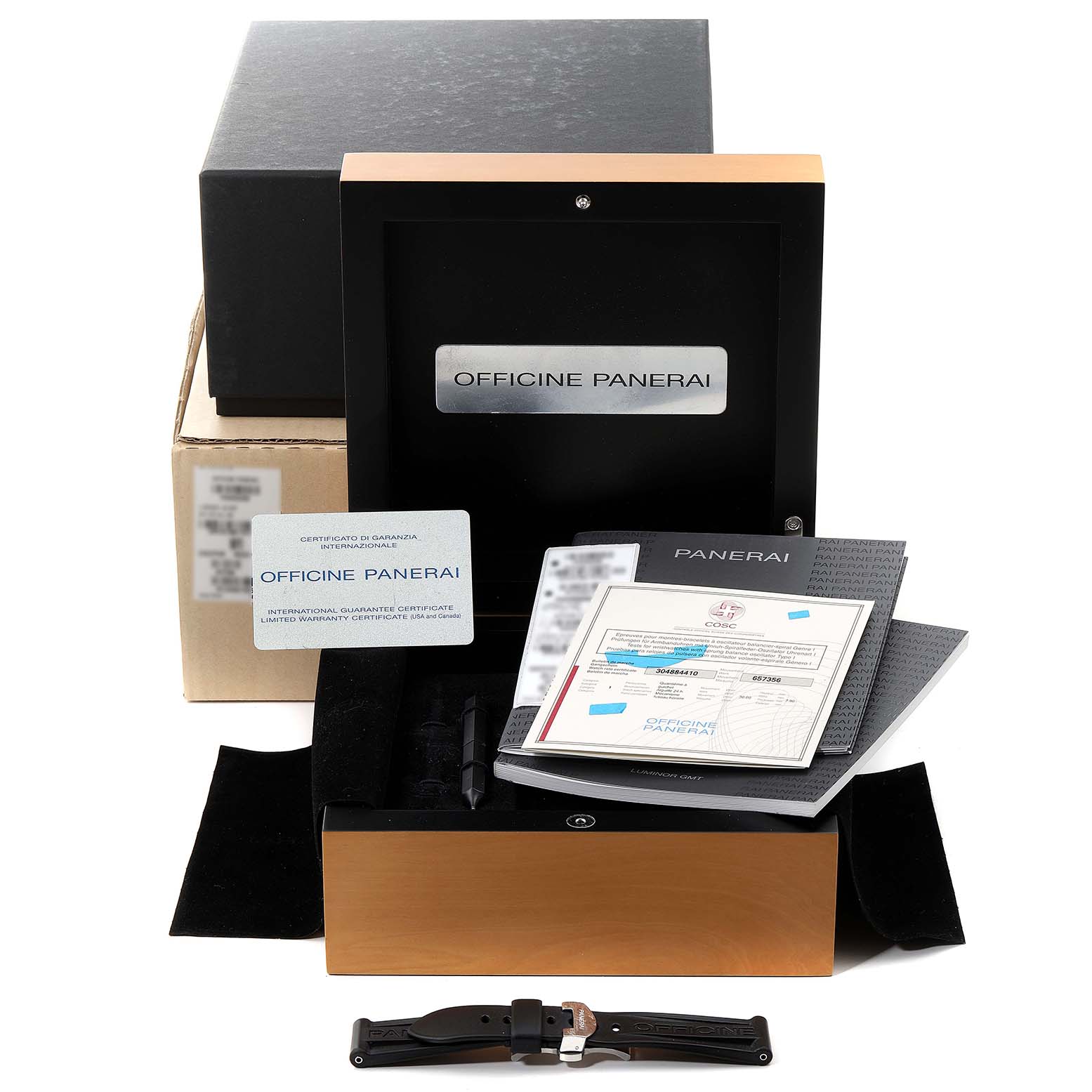 The image shows a Panerai Luminor PAM00088 Men
s Stainless Steel Black Dial PAM00088 Men
s Stainless Steel Black Dial watch box, manuals, warranty cards, and a spare strap accessory from a front angle.