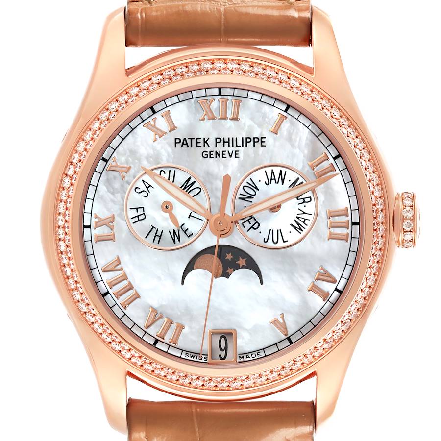 The Patek Philippe Complications watch is shown from the front, displaying its dial, rose gold case, and leather strap.