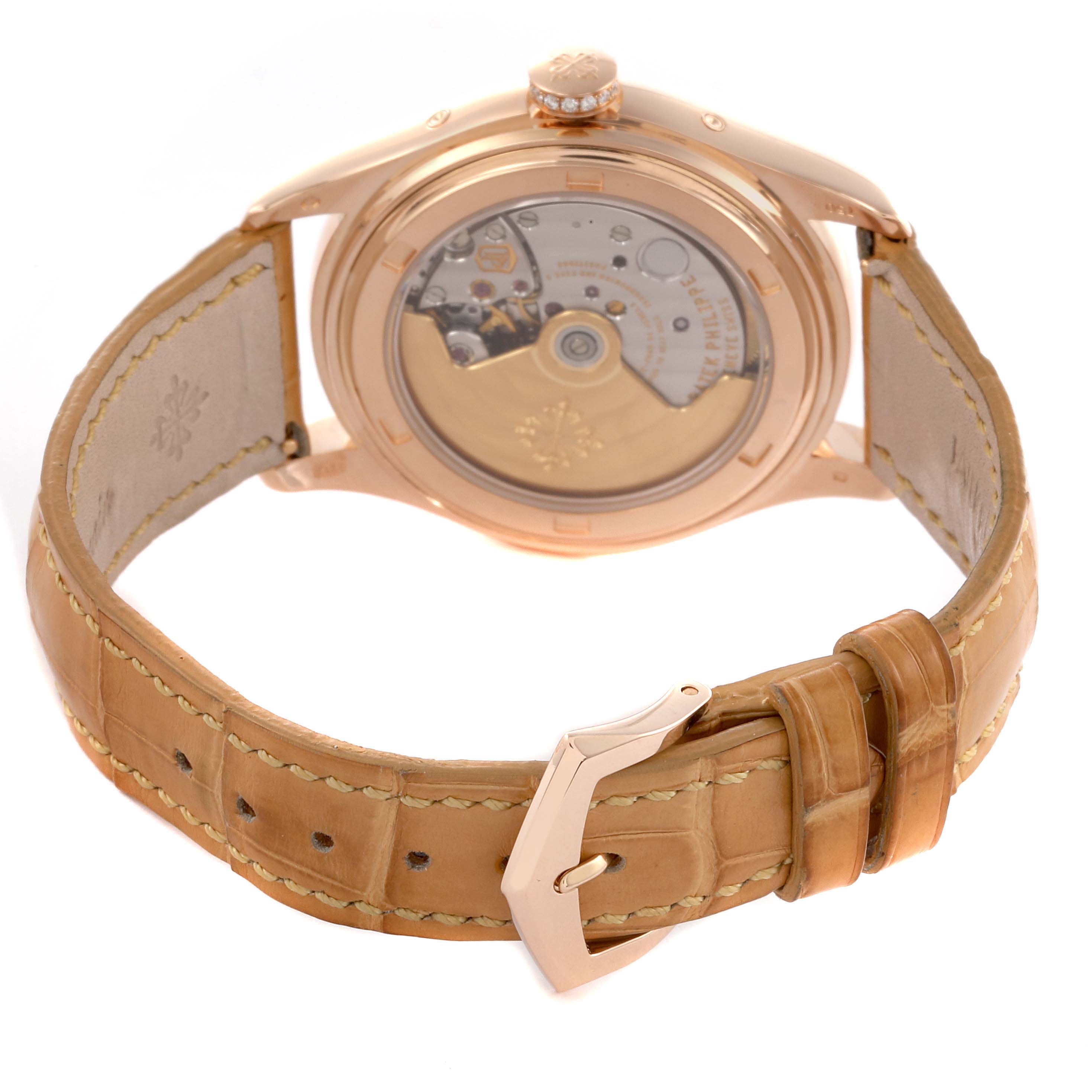 The Patek Philippe Complications 4936R-001 Men's Rose Gold Mother of Pearl Dial 4936R-001 Men's Rose Gold Mother of Pearl Dial watch is shown from the back, highlighting the movement and the leather strap with its buckle.