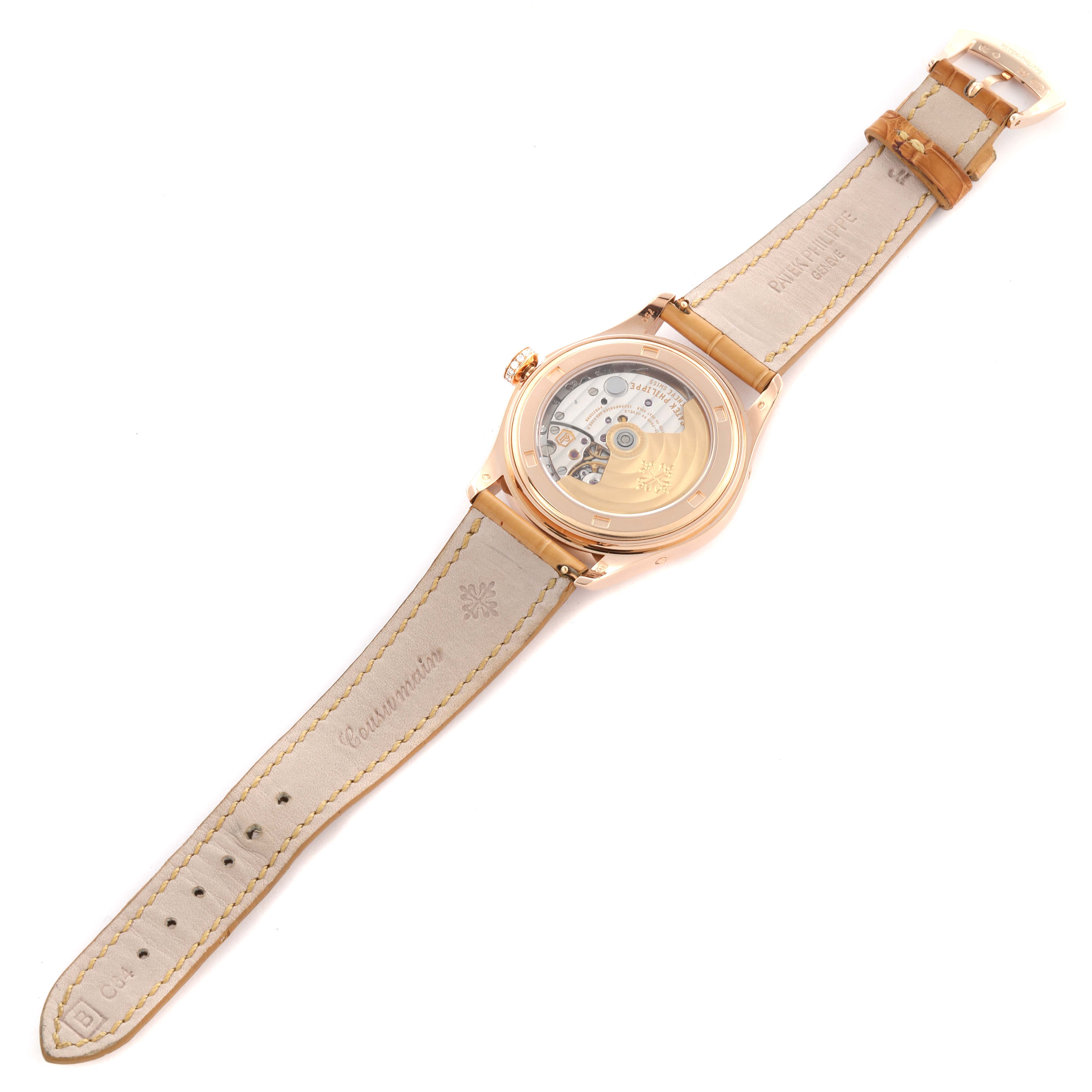 The Patek Philippe Complications 4936R-001 Men's Rose Gold Mother of Pearl Dial 4936R-001 Men's Rose Gold Mother of Pearl Dial model is shown from the back, displaying the transparent case back and inner mechanisms.